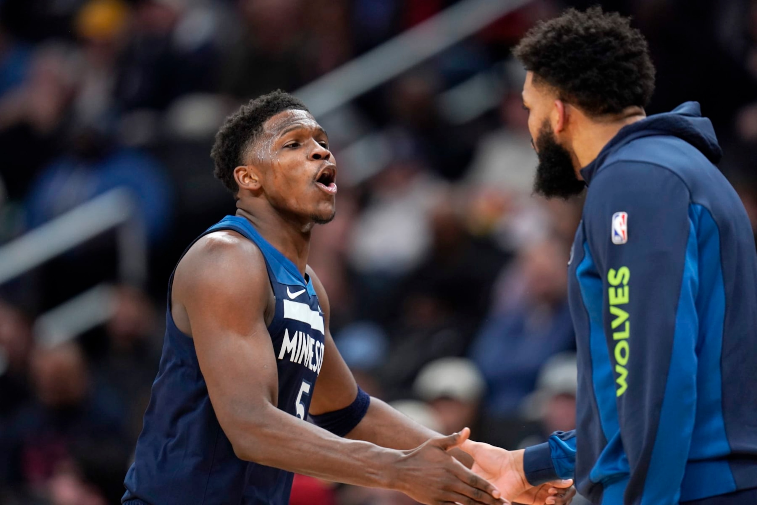 WASHINGTON, DC - JANUARY 24: Anthony Edwards #5 of the Minnesota Timberwolves celebrates with Karl-Anthony Towns #32 during a timeout in the second half against the Washington Wizards at Capital One Arena on January 24, 2024 in Washington, DC. NOTE TO USER: User expressly acknowledges and agrees that, by downloading and or using this photograph, User is consenting to the terms and conditions of the Getty Images License Agreement. (Photo by Jess Rapfogel/Getty Images)