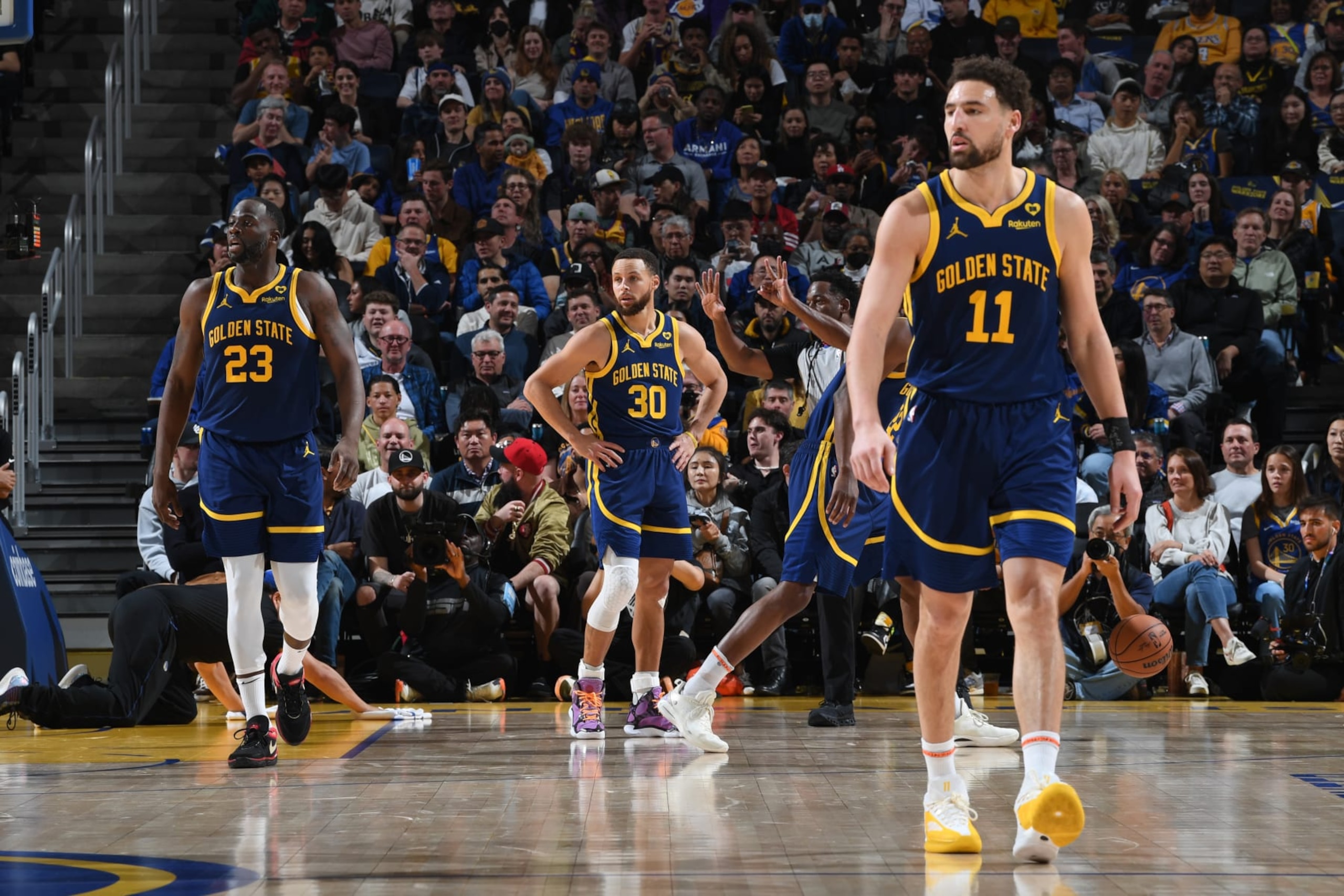 SAN FRANCISCO, CA - JANUARY 27: Draymond Green #23, Stephen Curry #30 and Klay Thompson #11 of the Golden State Warriors stand on the court during the game against the Los Angeles Lakers on January 27, 2024 at Chase Center in San Francisco, California. NOTE TO USER: User expressly acknowledges and agrees that, by downloading and or using this photograph, user is consenting to the terms and conditions of Getty Images License Agreement. Mandatory Copyright Notice: Copyright 2024 NBAE (Photo by Noah Graham/NBAE via Getty Images)