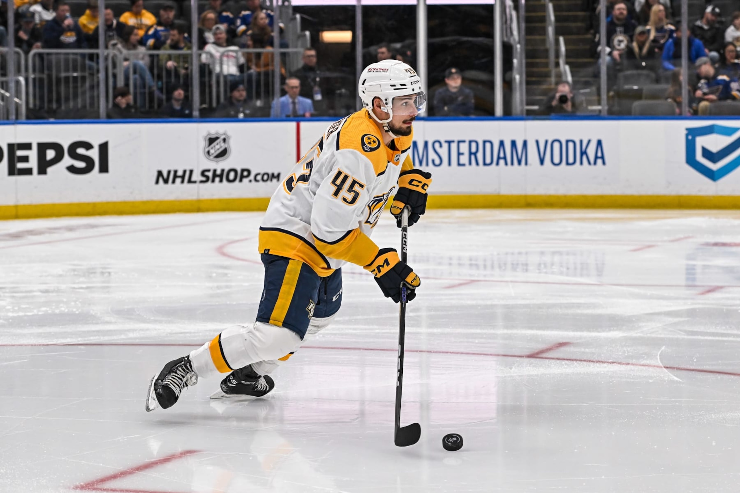 ST. LOUIS, MO - February 17: Nashville Predators defenseman Alexandre Carrier (45) steps and starts to skate the puck out of his own zone during a regular season game between the Nashville Predators and the St. Louis Blues on February 17, 2024, at the Enterprise Center in St. Louis MO (Photo by Rick Ulreich/Icon Sportswire via Getty Images)