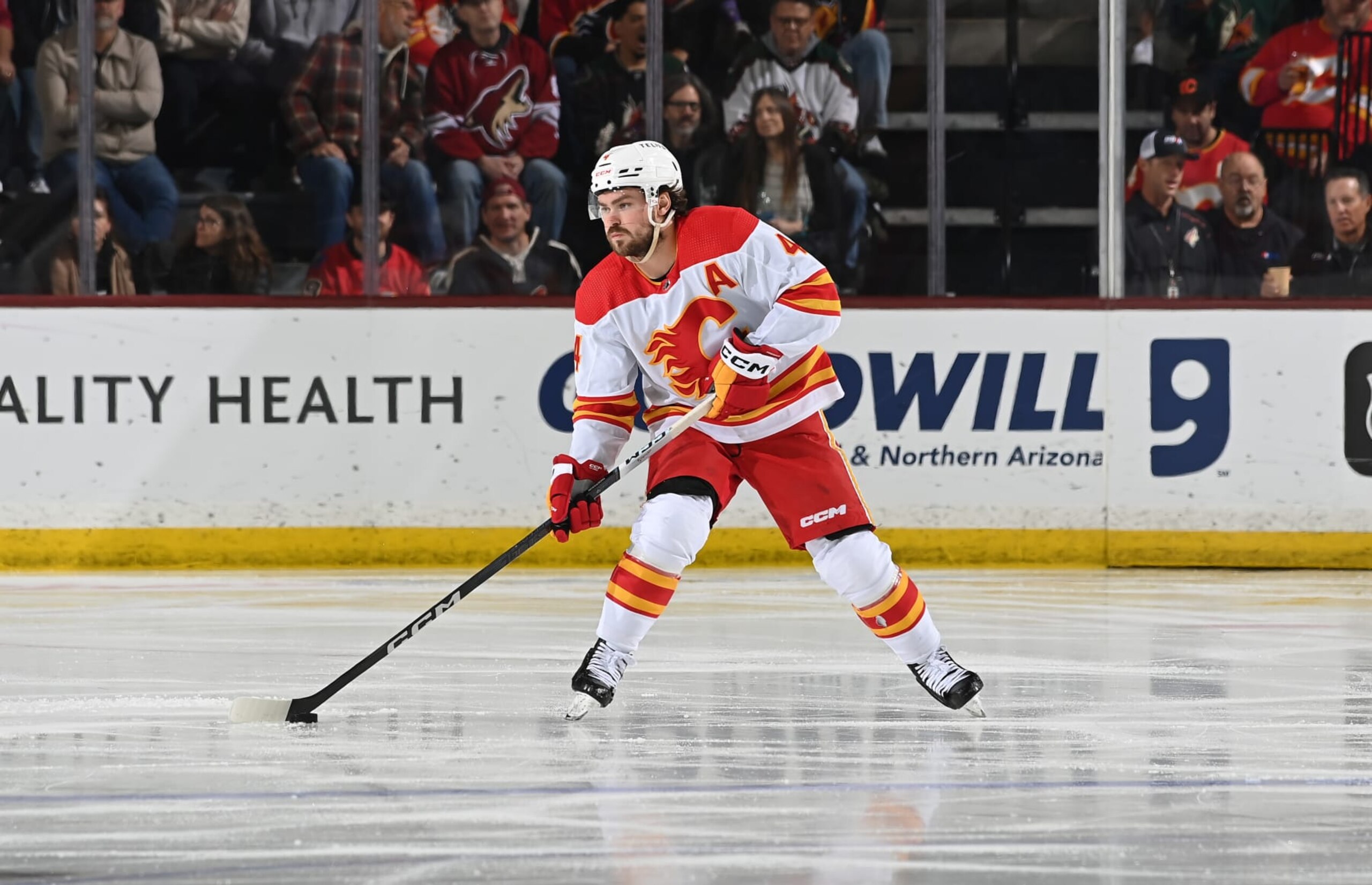 TEMPE, ARIZONA - JANUARY 11: Rasmus Andersson #4 of the Calgary Flames skates with the puck against the Arizona Coyotes at Mullett Arena on January 11, 2024 in Tempe, Arizona. (Photo by Norm Hall/NHLI via Getty Images)