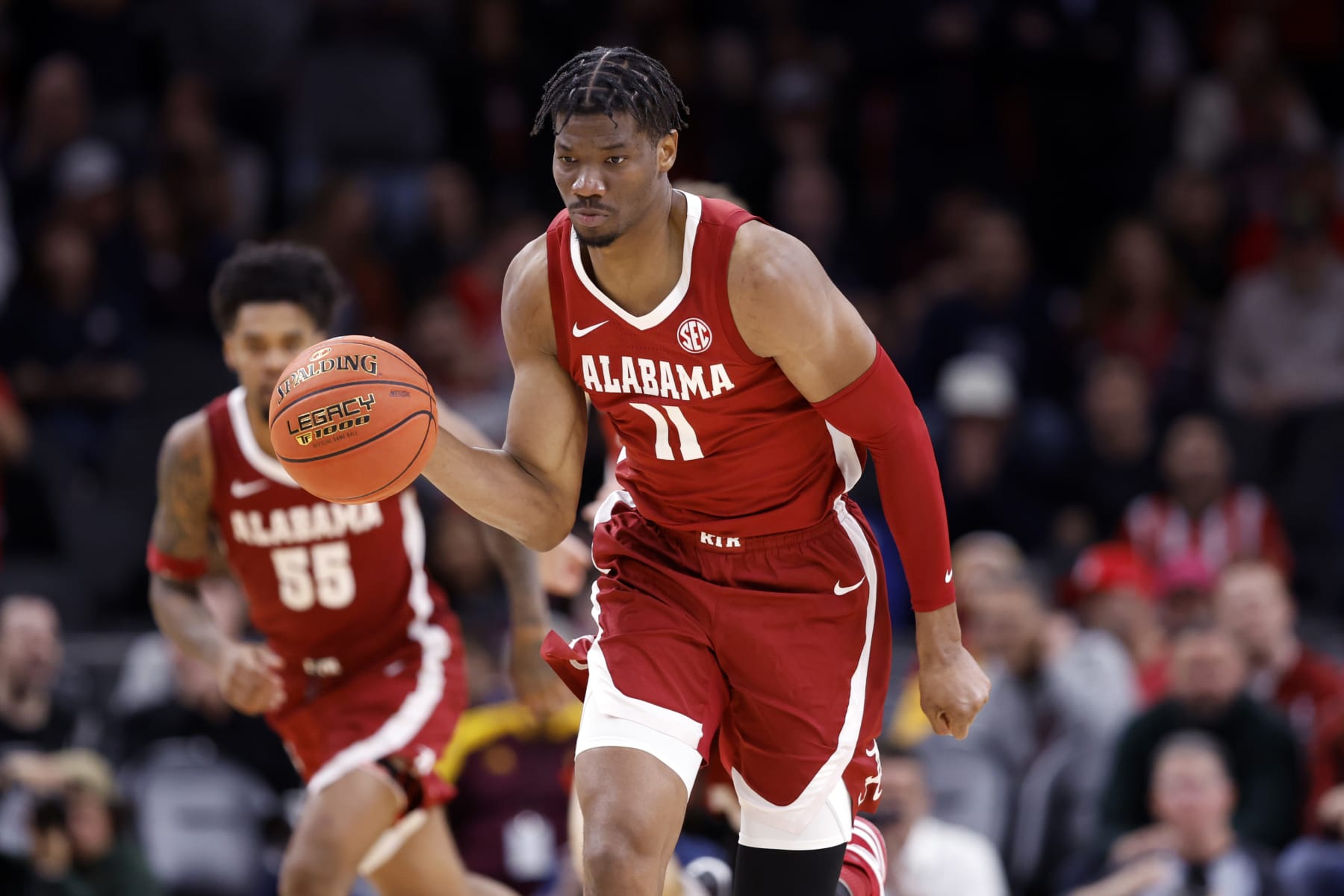 PHOENIX, ARIZONA - DECEMBER 20: Mohamed Wague #11 of the Alabama Crimson Tide controls the ball during the second half of the Jerry Colangelo's 2023 Hall of Fame Series Phoenix game against the Arizona Wildcats at Footprint Center on December 20, 2023 in Phoenix, Arizona. The Wildcats defeated the Crimson Tide 87-74. (Photo by Chris Coduto/Getty Images)