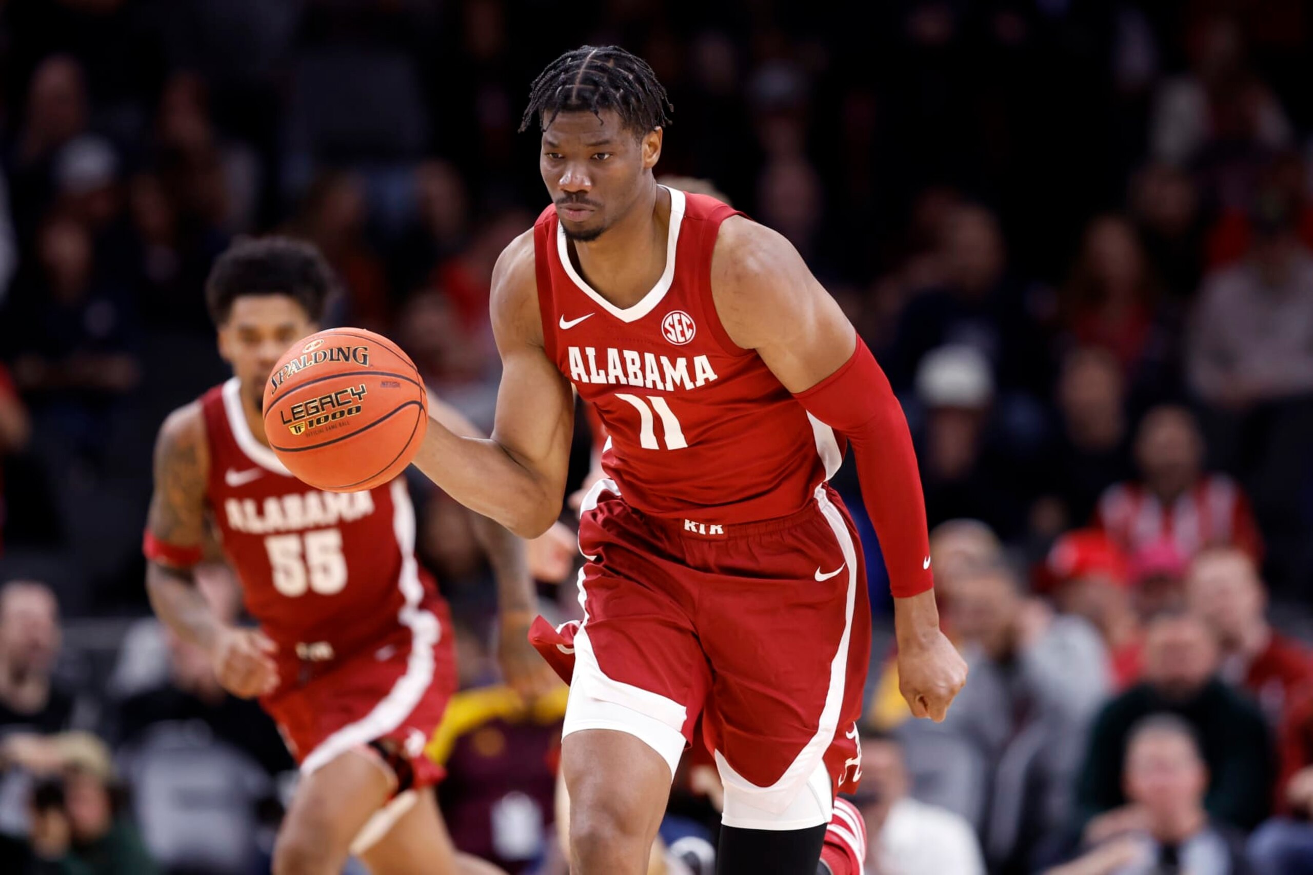 PHOENIX, ARIZONA - DECEMBER 20: Mohamed Wague #11 of the Alabama Crimson Tide controls the ball during the second half of the Jerry Colangelo's 2023 Hall of Fame Series Phoenix game against the Arizona Wildcats at Footprint Center on December 20, 2023 in Phoenix, Arizona. The Wildcats defeated the Crimson Tide 87-74. (Photo by Chris Coduto/Getty Images)