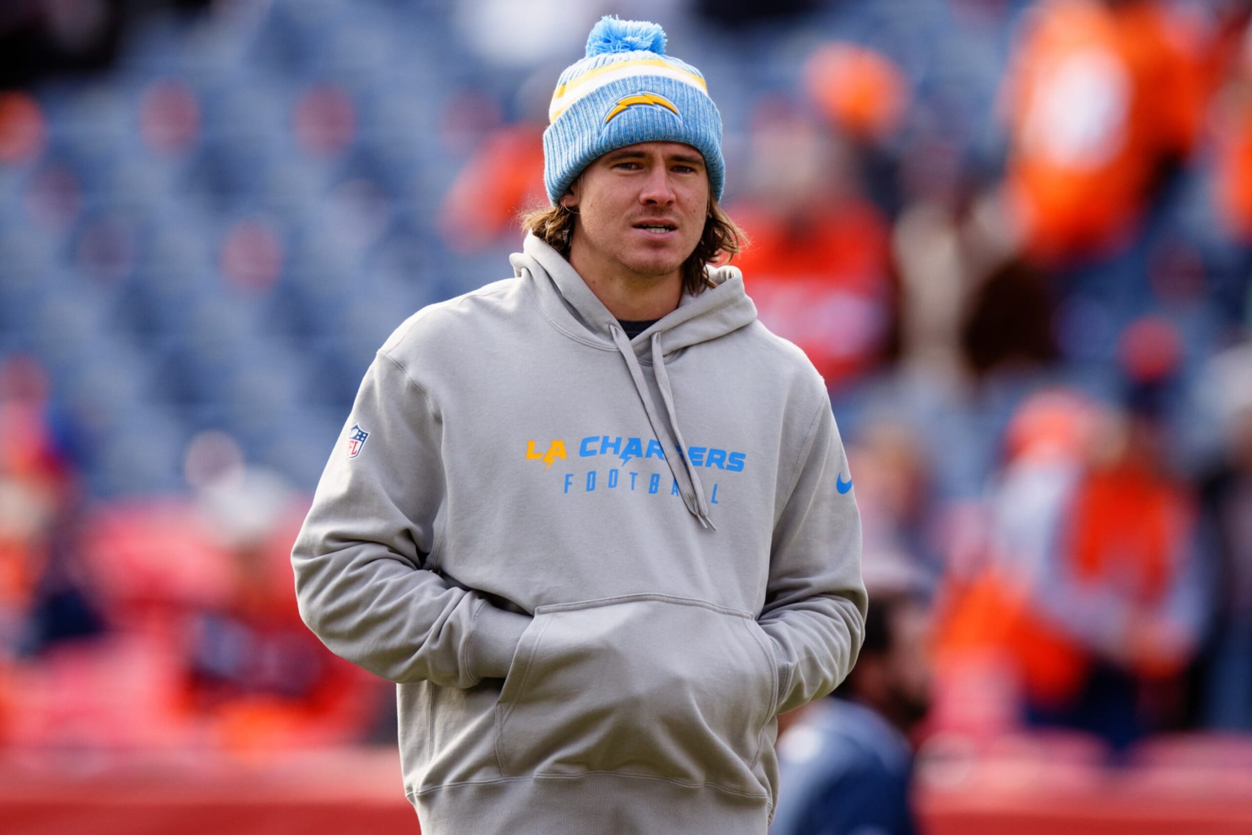 DENVER, CO - DECEMBER 31:  Quarterback Justin Herbert #10 of the Los Angeles Chargers stands on the field before a game against the Denver Broncos at Empower Field at Mile High on December 31, 2023 in Denver, Colorado. (Photo by Justin Edmonds/Getty Images)