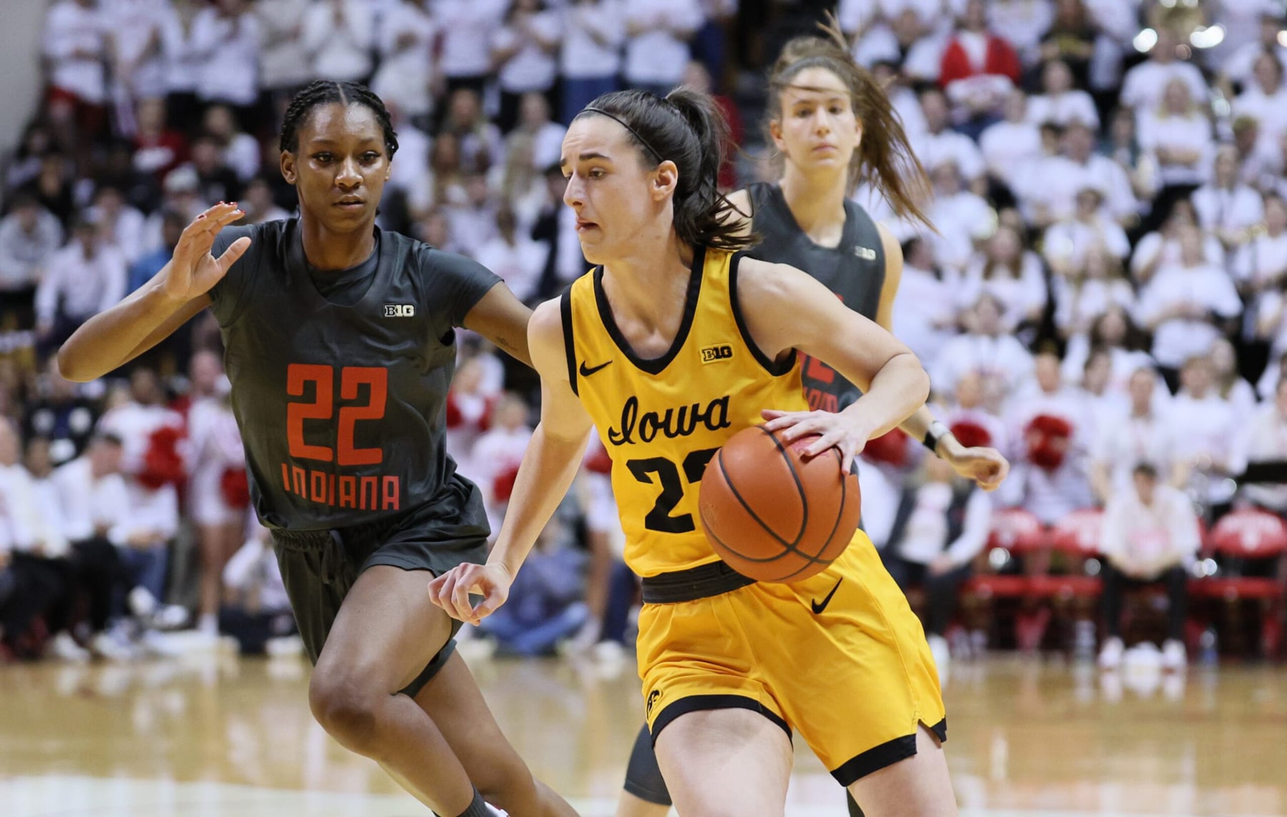 BLOOMINGTON, INDIANA - FEBRUARY 22: Caitlin Clark #22 of the Iowa Hawkeyes dribbles the ball in the first half against the Indiana Hoosiers at Simon Skjodt Assembly Hall on February 22, 2024 in Bloomington, Indiana. (Photo by Andy Lyons/Getty Images) BLOOMINGTON, INDIANA - FEBRUARY 22: Caitlin Clark #22 of the Iowa Hawkeyes dribbles the ball in the first half against the Indiana Hoosiers at Simon Skjodt Assembly Hall on February 22, 2024 in Bloomington, Indiana. (Photo by Andy Lyons/Getty Images)