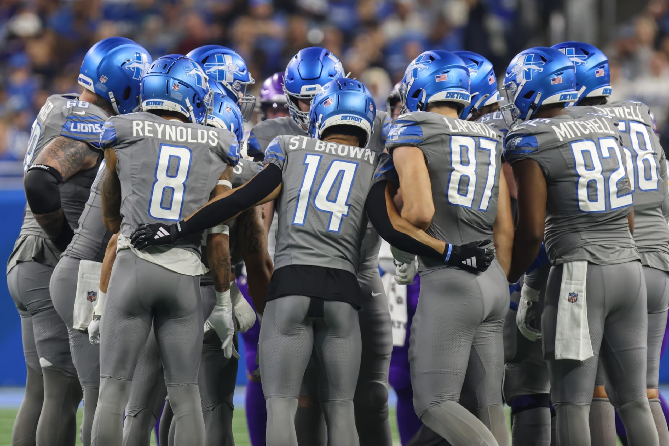 DETROIT, MI - JANUARY 07: Detroit Lions wide receivers Josh Reynolds (8) and Amon-Ra St. Brown (14) and Detroit Lions tight ends Sam LaPorta (87) and James Mitchell (82) listen for the play call in the huddle during an NFL football game between the Minnesota Vikings and the Detroit Lions on January 7, 2024 at Ford Field in Detroit, Michigan.  (Photo by Scott W. Grau/Icon Sportswire via Getty Images)