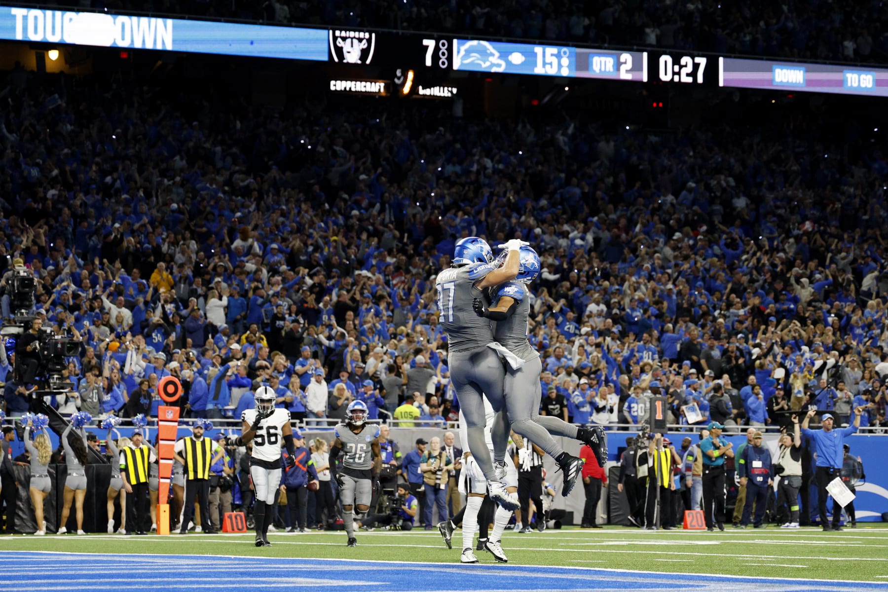 DETROIT, MICHIGAN - OCTOBER 30:  Sam LaPorta #87 of the Detroit Lions celebrates his touchdown with Amon-Ra St. Brown #14 in the second quarter against the Las Vegas Raiders at Ford Field on October 30, 2023 in Detroit, Michigan. (Photo by Mike Mulholland/Getty Images)