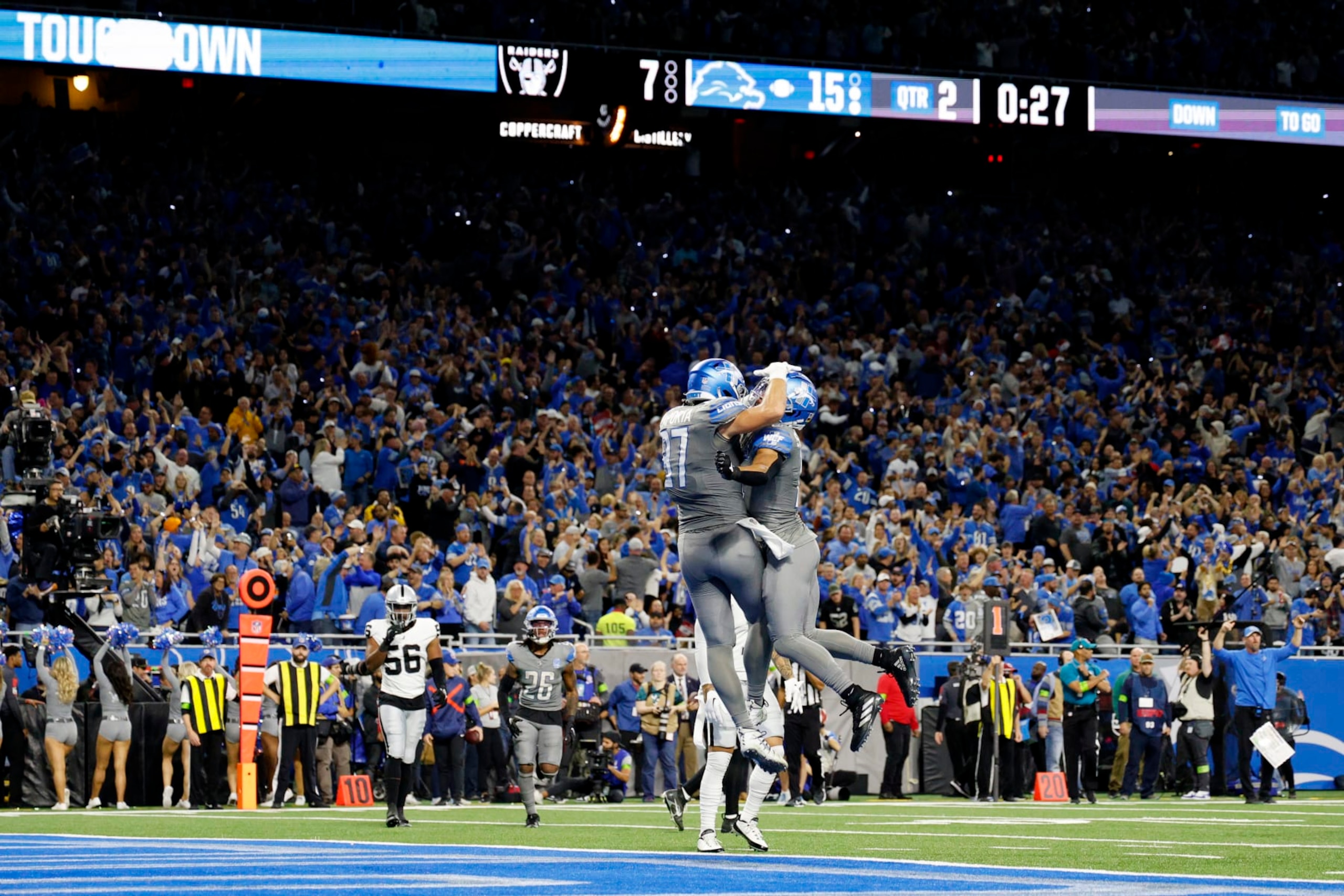 DETROIT, MICHIGAN - OCTOBER 30:  Sam LaPorta #87 of the Detroit Lions celebrates his touchdown with Amon-Ra St. Brown #14 in the second quarter against the Las Vegas Raiders at Ford Field on October 30, 2023 in Detroit, Michigan. (Photo by Mike Mulholland/Getty Images)