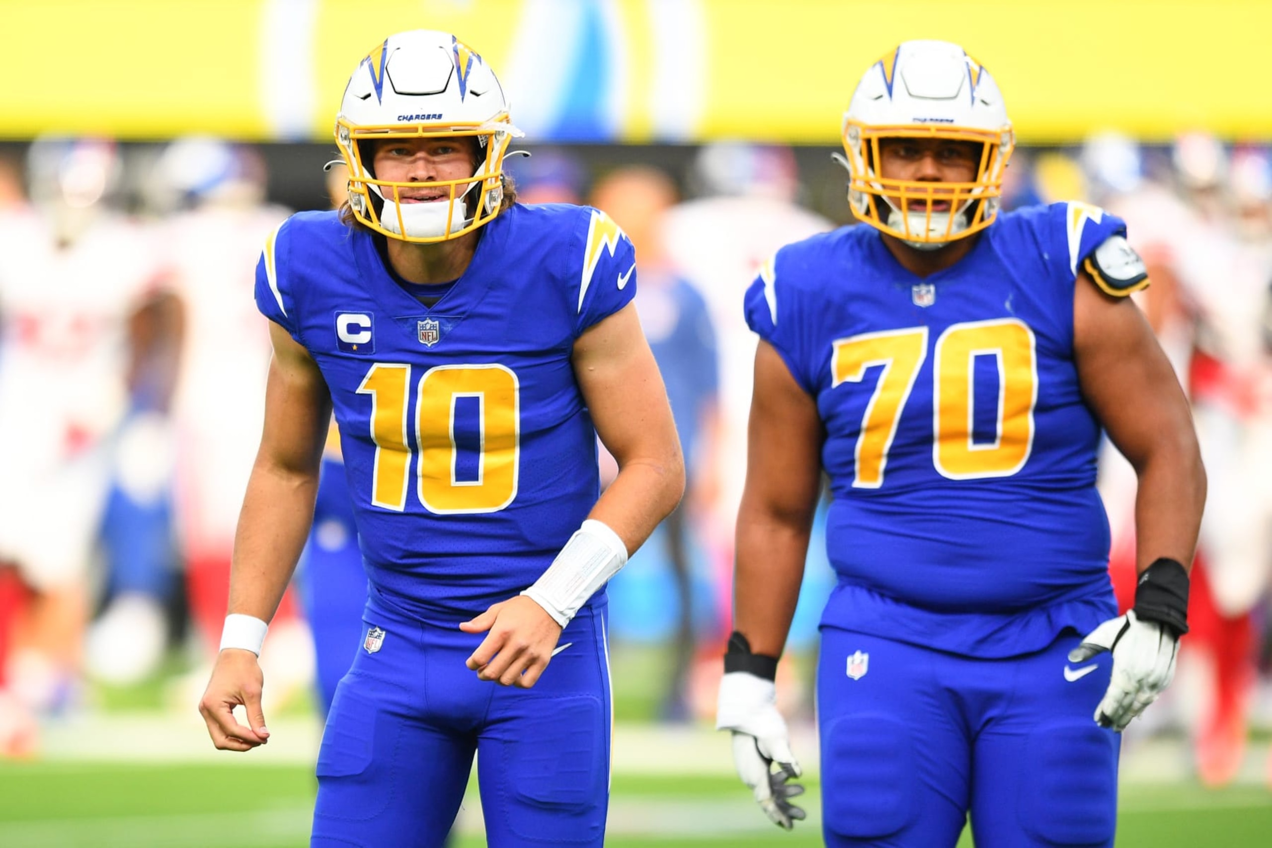 INGLEWOOD, CA - DECEMBER 12: Los Angeles Chargers Quarterback Justin Herbert (10) celebrates with Los Angeles Chargers Offensive Tackle Rashawn Slater (70)
during the NFL game between the New York Giants and the Los Angeles Chargers on December 12, 2021, at SoFi Stadium in Inglewood, CA. (Photo by Brian Rothmuller/Icon Sportswire via Getty Images)