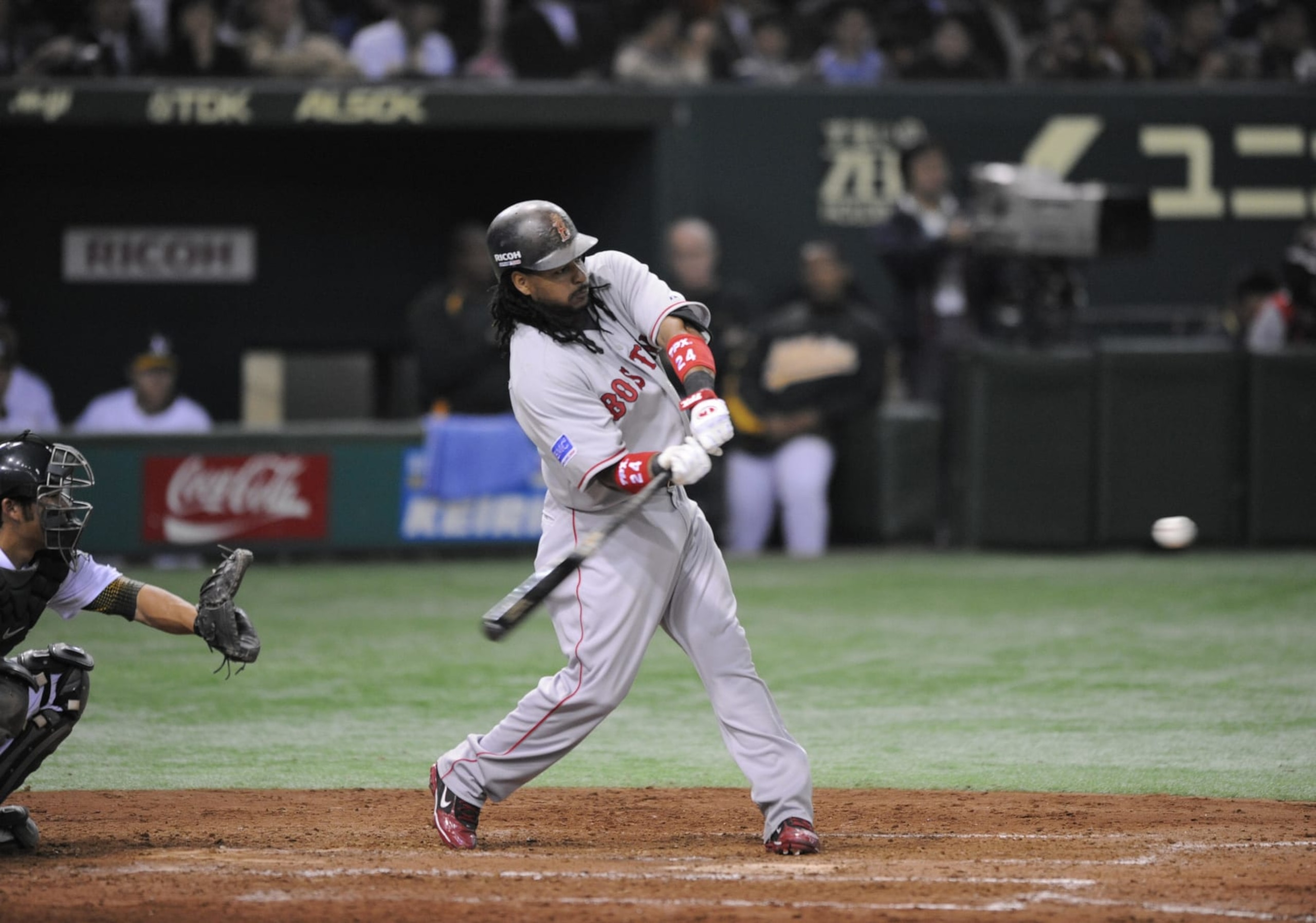 Boston Red Sox Manny Ramirez makes a solo homer in the 6th inning against Oakland Athletics of the second day of the 2008 MLB Japan Series season's opening games at Tokyo Dome on March 26, 2008. Athletics is leading 4-1 on the 6th inning. AFP PHOTO / KAZUHIRO NOGI (Photo credit should read KAZUHIRO NOGI/AFP via Getty Images) Boston Red Sox Manny Ramirez makes a solo homer in the 6th inning against Oakland Athletics of the second day of the 2008 MLB Japan Series season's opening games at Tokyo Dome on March 26, 2008. Athletics is leading 4-1 on the 6th inning. AFP PHOTO / KAZUHIRO NOGI (Photo credit should read KAZUHIRO NOGI/AFP via Getty Images)