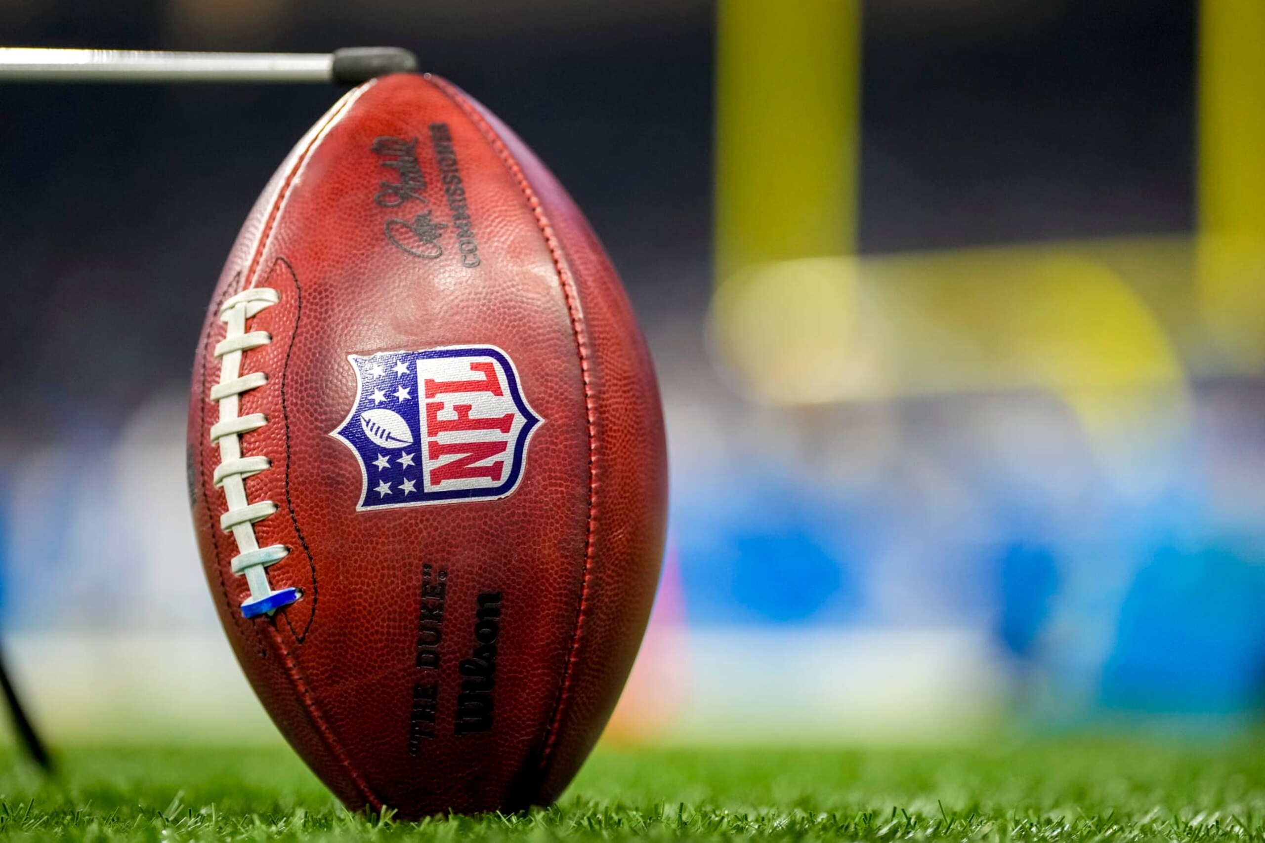 DETROIT, MICHIGAN - JANUARY 07: A detail of a Wilson brand NFL The Duke football held up by a kicking tee during the game between the Minnesota Vikings and Detroit Lions Ford Field on January 07, 2024 in Detroit, Michigan. (Photo by Nic Antaya/Getty Images) DETROIT, MICHIGAN - JANUARY 07: A detail of a Wilson brand NFL The Duke football held up by a kicking tee during the game between the Minnesota Vikings and Detroit Lions Ford Field on January 07, 2024 in Detroit, Michigan. (Photo by Nic Antaya/Getty Images)