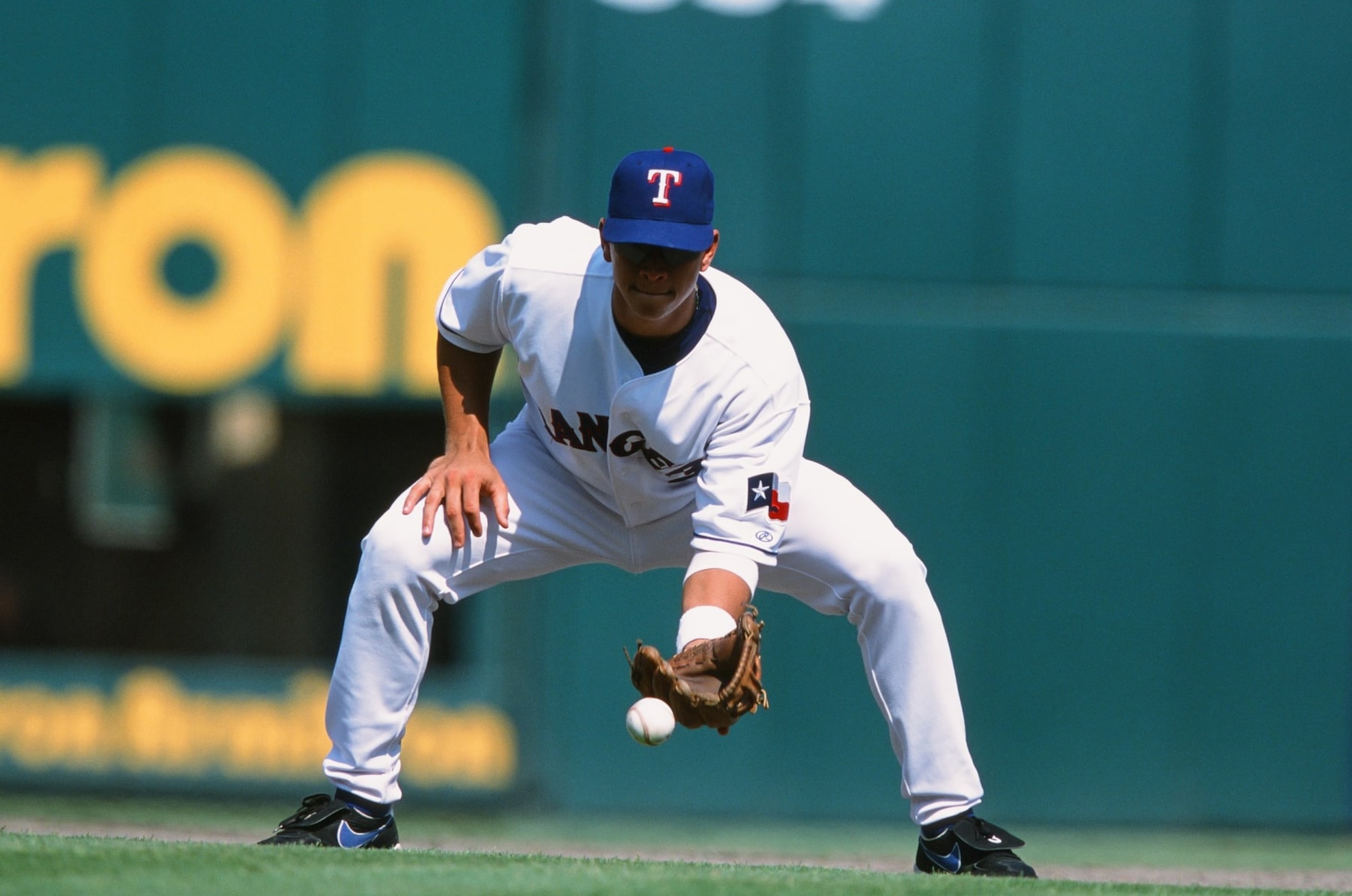 ARLINGTON, TX - SEPTEMBER 2: Alex Rodriguez of the Texas Rangers fields against the Houston Astros at The Ballpark in Arlington on September 2, 2002 in Arlington, Texas. (Photo by Sporting News via Getty Images via Getty Images) ARLINGTON, TX - SEPTEMBER 2: Alex Rodriguez of the Texas Rangers fields against the Houston Astros at The Ballpark in Arlington on September 2, 2002 in Arlington, Texas. (Photo by Sporting News via Getty Images via Getty Images)