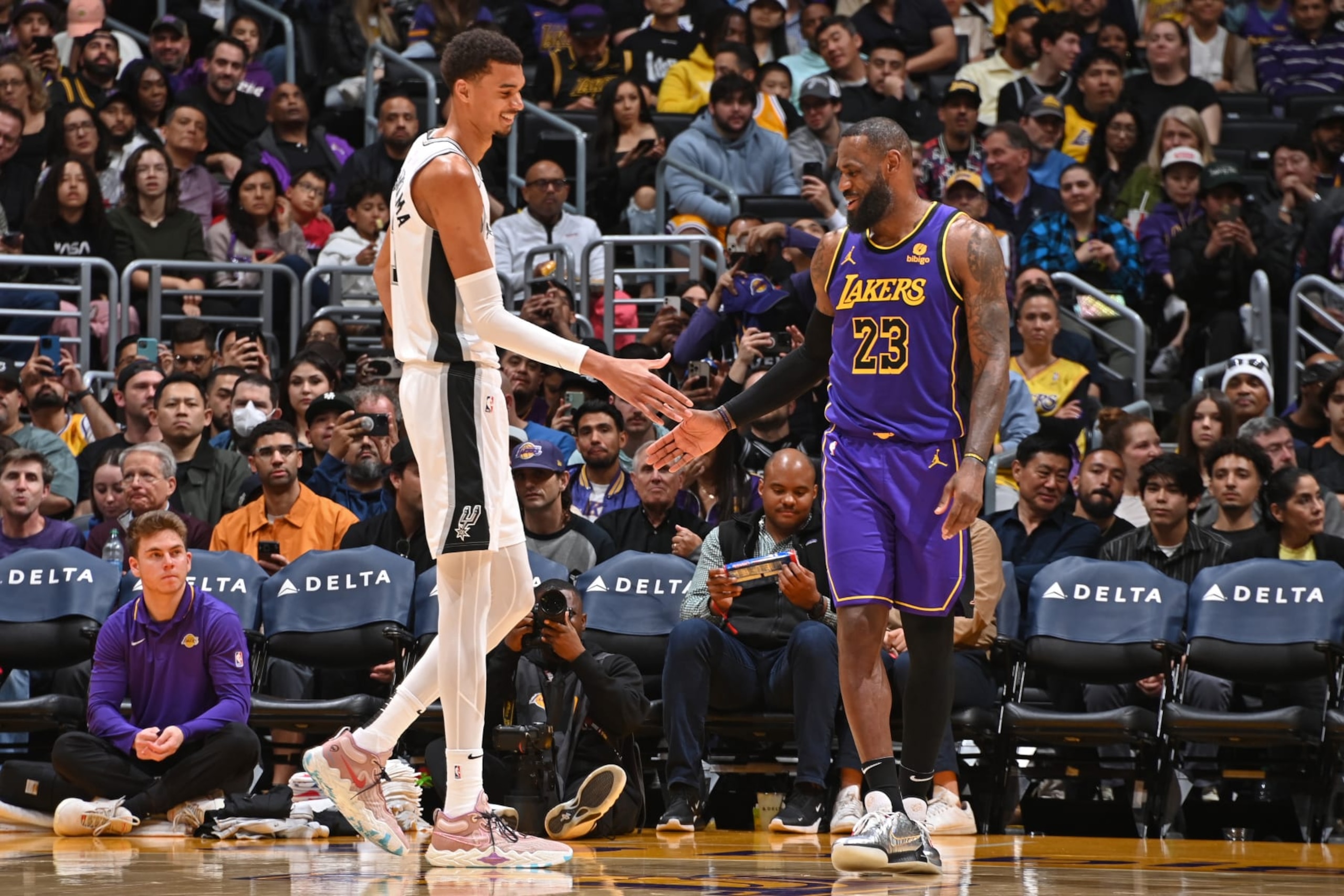 LOS ANGELES, CA - FEBRUARY 23: Victor Wembanyama #1 of the San Antonio Spurs and LeBron James #23 of the Los Angeles Lakers high five during the game on Feburary 23, 2024 at Crypto.Com Arena in Los Angeles, California. NOTE TO USER: User expressly acknowledges and agrees that, by downloading and/or using this Photograph, user is consenting to the terms and conditions of the Getty Images License Agreement. Mandatory Copyright Notice: Copyright 2024 NBAE (Photo by Andrew D. Bernstein/NBAE via Getty Images) LOS ANGELES, CA - FEBRUARY 23: Victor Wembanyama #1 of the San Antonio Spurs and LeBron James #23 of the Los Angeles Lakers high five during the game on Feburary 23, 2024 at Crypto.Com Arena in Los Angeles, California. NOTE TO USER: User expressly acknowledges and agrees that, by downloading and/or using this Photograph, user is consenting to the terms and conditions of the Getty Images License Agreement. Mandatory Copyright Notice: Copyright 2024 NBAE (Photo by Andrew D. Bernstein/NBAE via Getty Images)