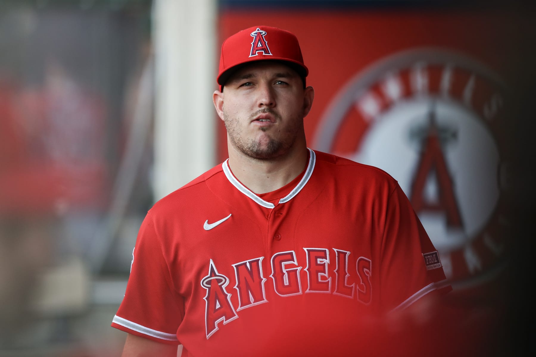 ANAHEIM, CALIFORNIA - AUGUST 22: Mike Trout #27 of the Los Angeles Angels looks on from the dugout ahead of the game against the Cincinnati Reds at Angel Stadium of Anaheim on August 22, 2023 in Anaheim, California. (Photo by Meg Oliphant/Getty Images)