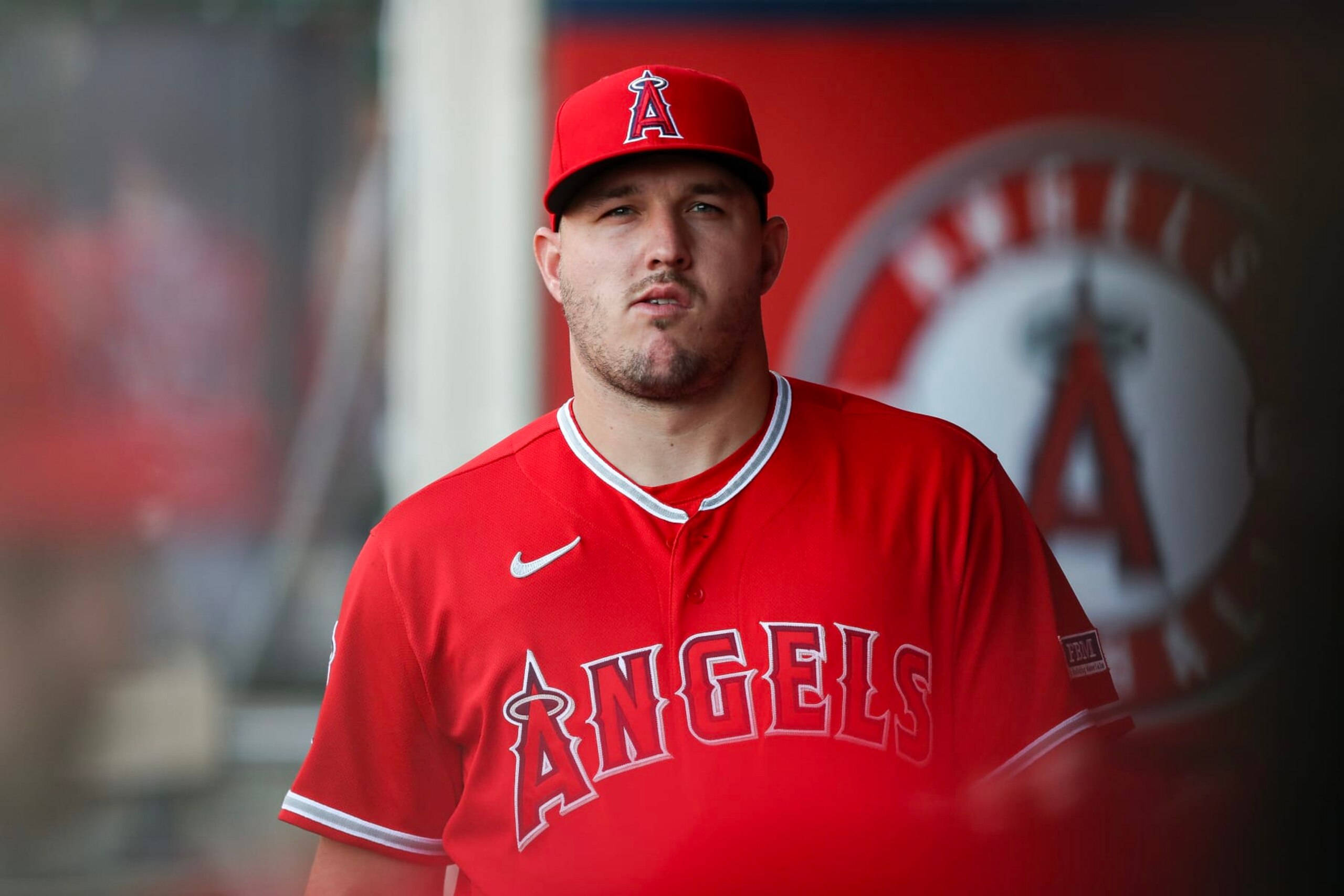 ANAHEIM, CALIFORNIA - AUGUST 22: Mike Trout #27 of the Los Angeles Angels looks on from the dugout ahead of the game against the Cincinnati Reds at Angel Stadium of Anaheim on August 22, 2023 in Anaheim, California. (Photo by Meg Oliphant/Getty Images)