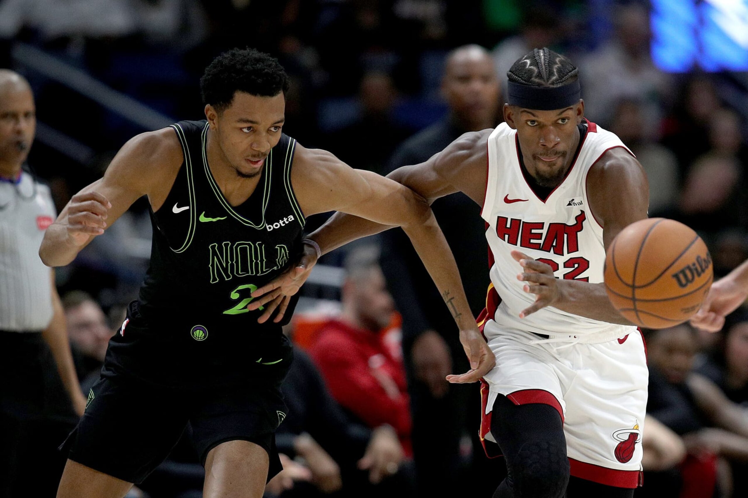 NEW ORLEANS, LOUISIANA - FEBRUARY 23: Jimmy Butler #22 of the Miami Heat steals the ball form Herbert Jones #5 of the New Orleans Pelicans during the fourth quarter of an NBA game at Smoothie King Center on February 23, 2024 in New Orleans, Louisiana. NOTE TO USER: User expressly acknowledges and agrees that, by downloading and or using this photograph, User is consenting to the terms and conditions of the Getty Images License Agreement. (Photo by Sean Gardner/Getty Images) NEW ORLEANS, LOUISIANA - FEBRUARY 23: Jimmy Butler #22 of the Miami Heat steals the ball form Herbert Jones #5 of the New Orleans Pelicans during the fourth quarter of an NBA game at Smoothie King Center on February 23, 2024 in New Orleans, Louisiana. NOTE TO USER: User expressly acknowledges and agrees that, by downloading and or using this photograph, User is consenting to the terms and conditions of the Getty Images License Agreement. (Photo by Sean Gardner/Getty Images)