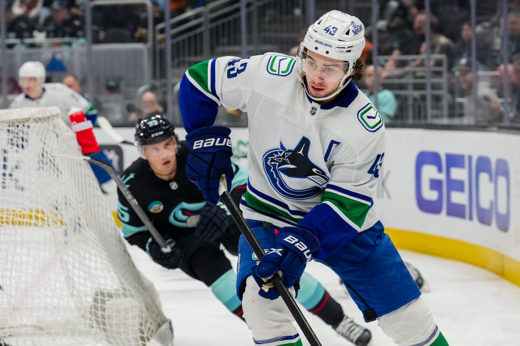 SEATTLE, WASHINGTON - FEBRUARY 22: Quinn Hughes #43 of the Vancouver Canucks skates with the puck during the first period of a game against the Seattle Kraken at Climate Pledge Arena on February 22, 2024 in Seattle, Washington. (Photo by Christopher Mast/NHLI via Getty Images)