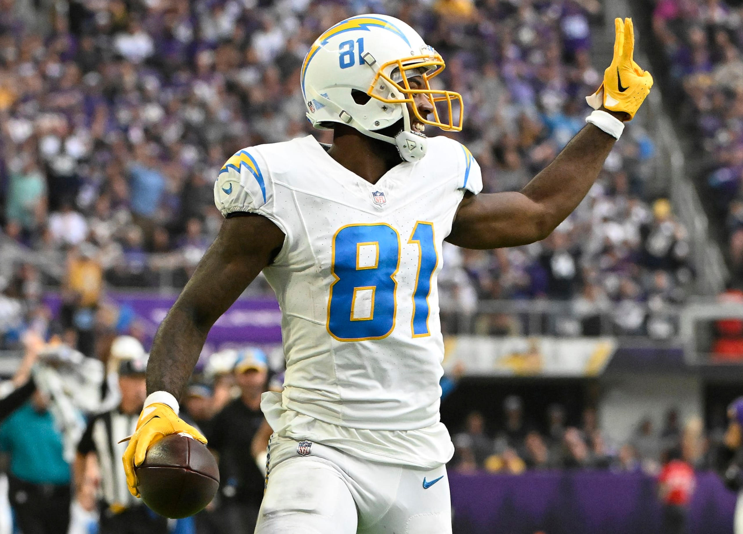 MINNEAPOLIS, MINNESOTA - SEPTEMBER 24: Mike Williams #81 of the Los Angeles Chargers celebrates while scoring a touchdown during the third quarter against the Minnesota Vikings at U.S. Bank Stadium on September 24, 2023 in Minneapolis, Minnesota. (Photo by Stephen Maturen/Getty Images)