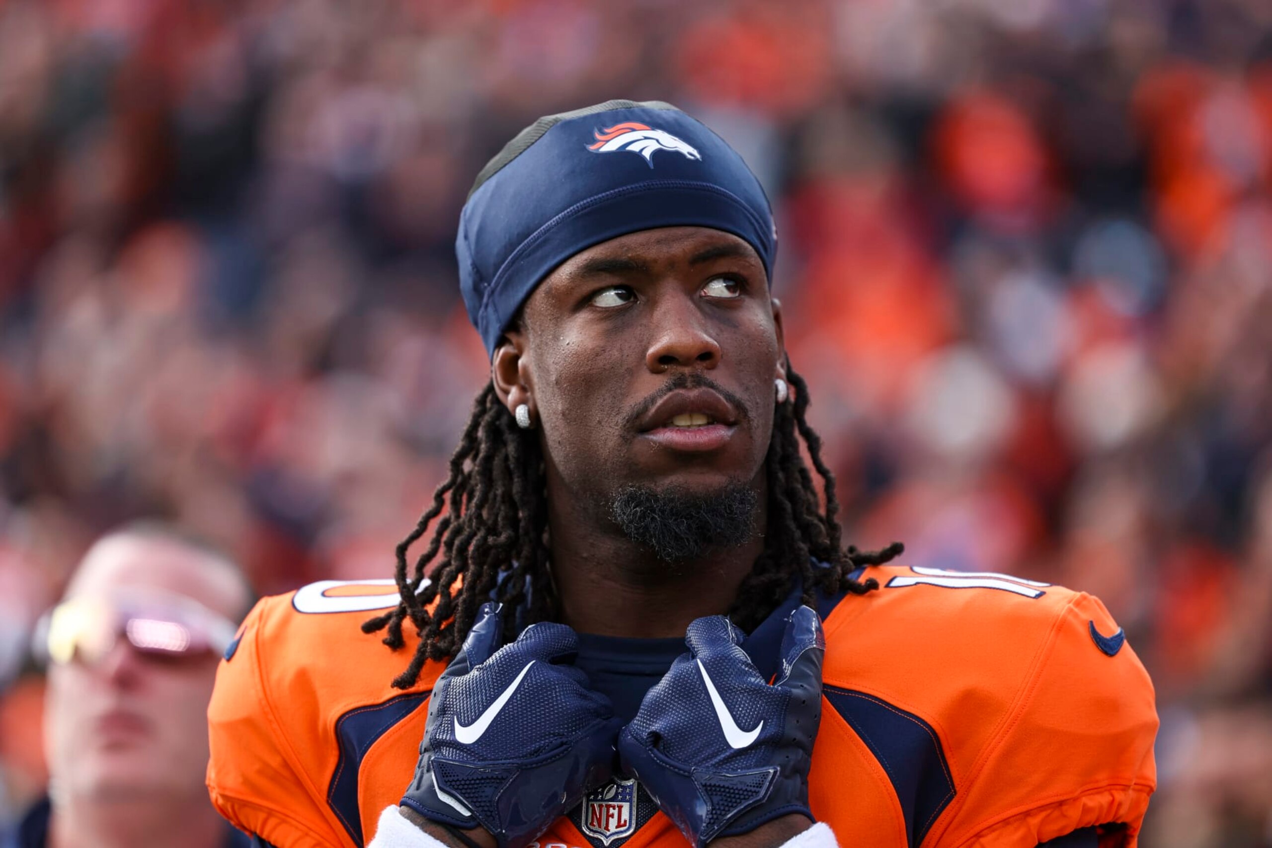 DENVER, CO - DECEMBER 31: Jerry Jeudy #10 of the Denver Broncos looks on from the sideline during the antional anthem prior to an NFL football game against the Los Angeles Chargers at Empower Field at Mile High on December 31, 2023 in Denver, Colorado. (Photo by Perry Knotts/Getty Images)