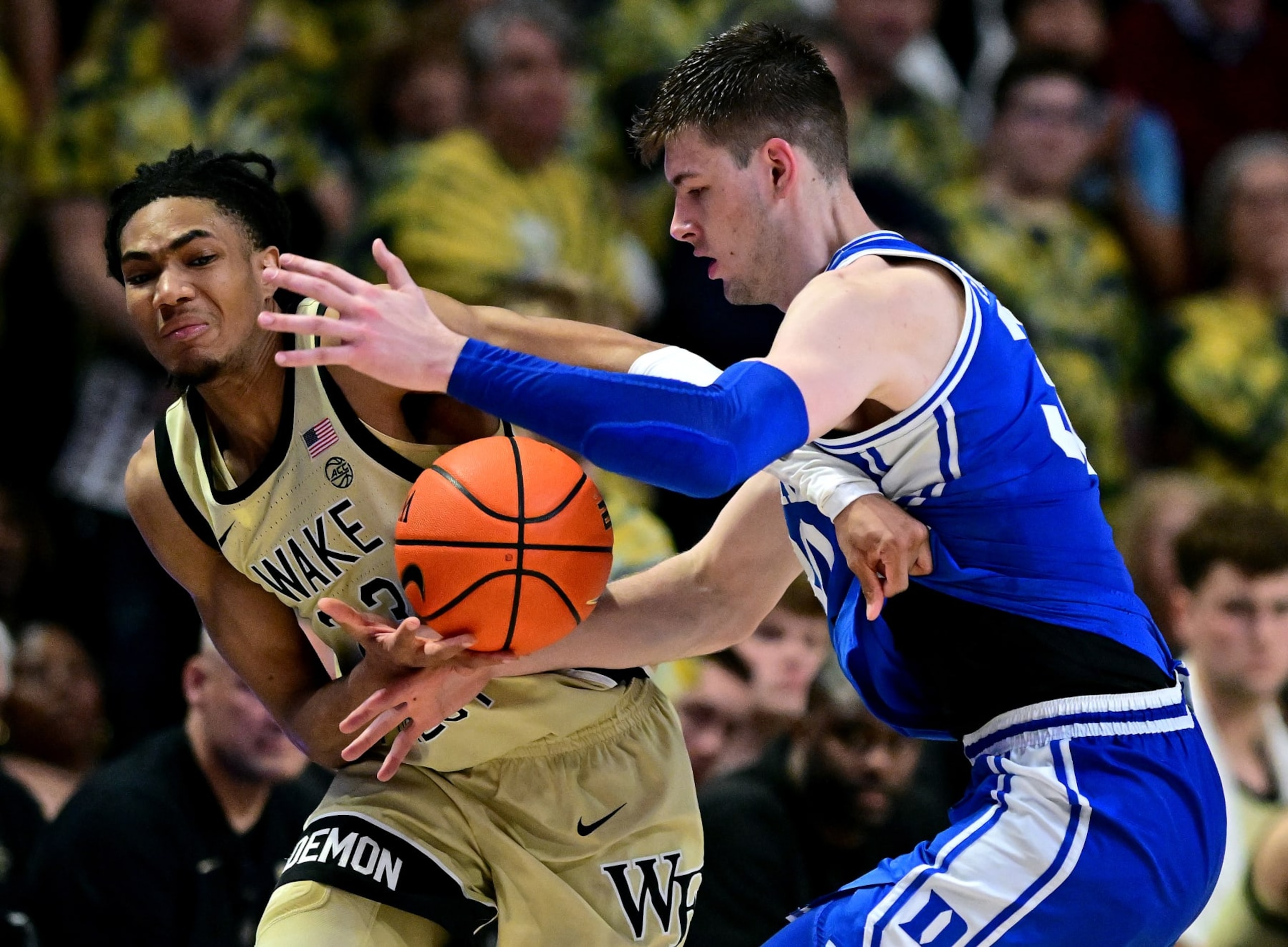WINSTON SALEM, NORTH CAROLINA - FEBRUARY 24: Hunter Sallis #23 of the Wake Forest Demon Deacons battles Kyle Filipowski #30 of the Duke Blue Devils for the ball during the second half of the game at Lawrence Joel Veterans Memorial Coliseum on February 24, 2024 in Winston Salem, North Carolina. Wake Forest won 83-79. (Photo by Grant Halverson/Getty Images)