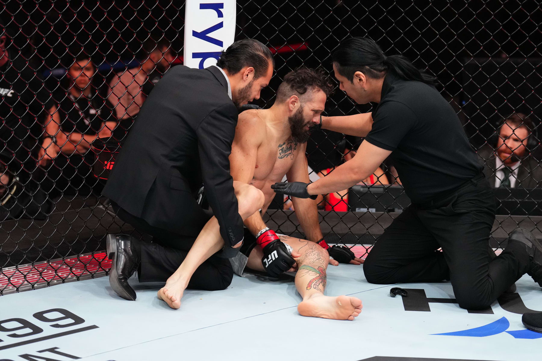 MEXICO CITY, MEXICO - FEBRUARY 24: Erik Silva of Venezuela receives attention from a referee after a stoppage against Muhammad Naimov of Tajikistan in a featherweight fight during the UFC Fight Night event at Arena CDMX on February 24, 2024 in Mexico City, Mexico. (Photo by Josh Hedges/Zuffa LLC via Getty Images)