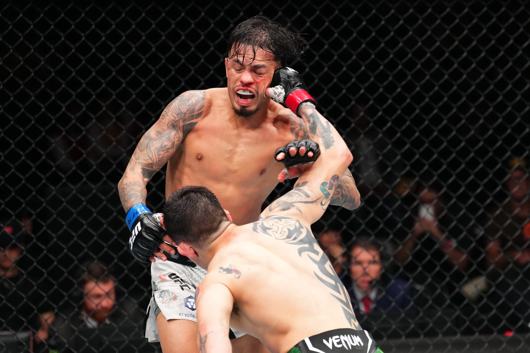 MEXICO CITY, MEXICO - FEBRUARY 24: (R-L) Brandon Moreno of Mexico punches Brandon Royval in a flyweight fight during the UFC Fight Night event at Arena CDMX on February 24, 2024 in Mexico City, Mexico. (Photo by Josh Hedges/Zuffa LLC via Getty Images)