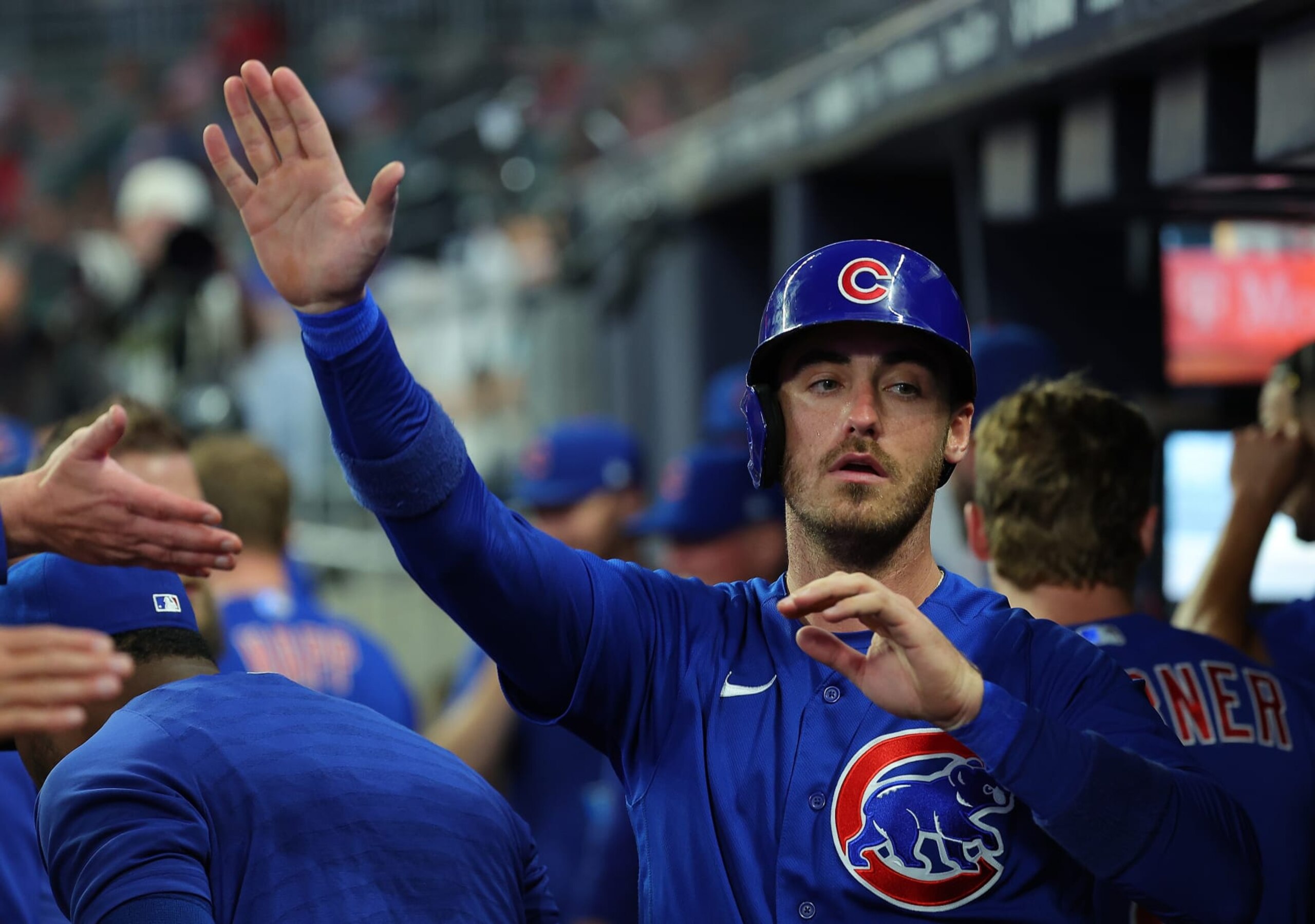 ATLANTA, GEORGIA - SEPTEMBER 26:  Cody Bellinger #24 of the Chicago Cubs reacts after scoring on a RBI single by Yan Gomes #15 in the second inning at Truist Park on September 26, 2023 in Atlanta, Georgia. (Photo by Kevin C. Cox/Getty Images)