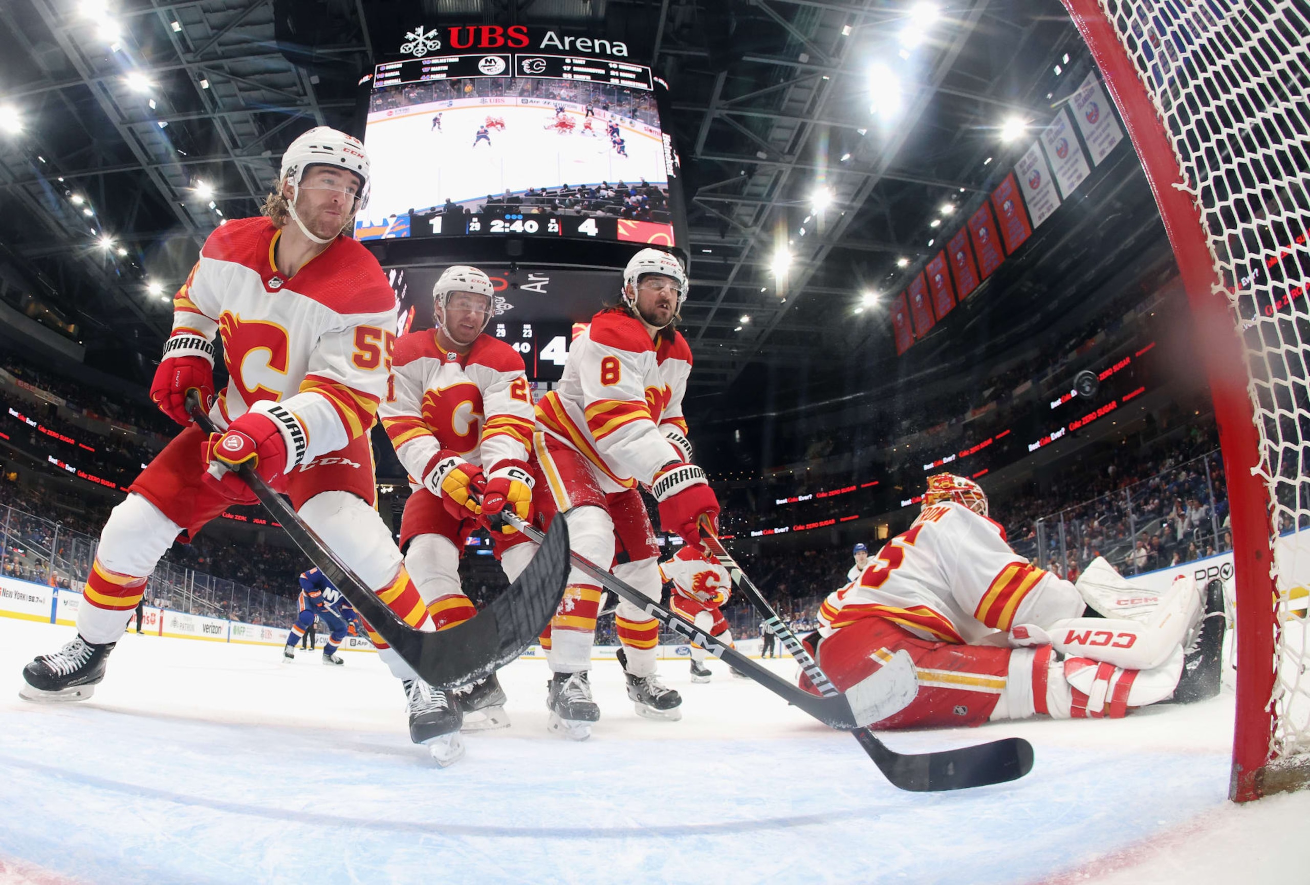 ELMONT, NEW YORK - FEBRUARY 10: (L-R) Noah Hanifin #55, Kevin Rooney #21, Chris Tanev #8 and Jacob Markstrom #35 of the Calgary Flames defend the net against the New York Islanders during the third period at UBS Arena on February 10, 2024 in Elmont, New York. The Flames defeated the Islanders 5-2. (Photo by Bruce Bennett/Getty Images) ELMONT, NEW YORK - FEBRUARY 10: (L-R) Noah Hanifin #55, Kevin Rooney #21, Chris Tanev #8 and Jacob Markstrom #35 of the Calgary Flames defend the net against the New York Islanders during the third period at UBS Arena on February 10, 2024 in Elmont, New York. The Flames defeated the Islanders 5-2. (Photo by Bruce Bennett/Getty Images)