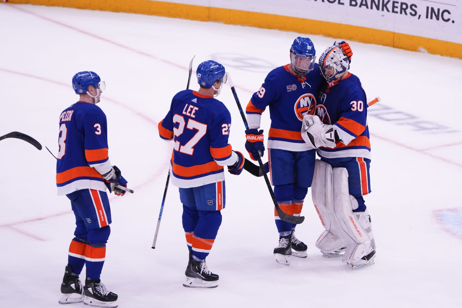 ELMONT, NY - APRIL 12: New York Islanders Center Brock Nelson (29) congratulates New York Islanders Goalie Ilya Sorokin (30) for the victory along with New York Islanders Left Wing Anders Lee (27) and New York Islanders Defenseman Adam Pelech (3) after the National Hockey League game between the Montreal Canadiens and the New York Islanders on 4/12/2023, at UBS Arena in Elmont, NY. (Photo by Gregory Fisher/Icon Sportswire via Getty Images)