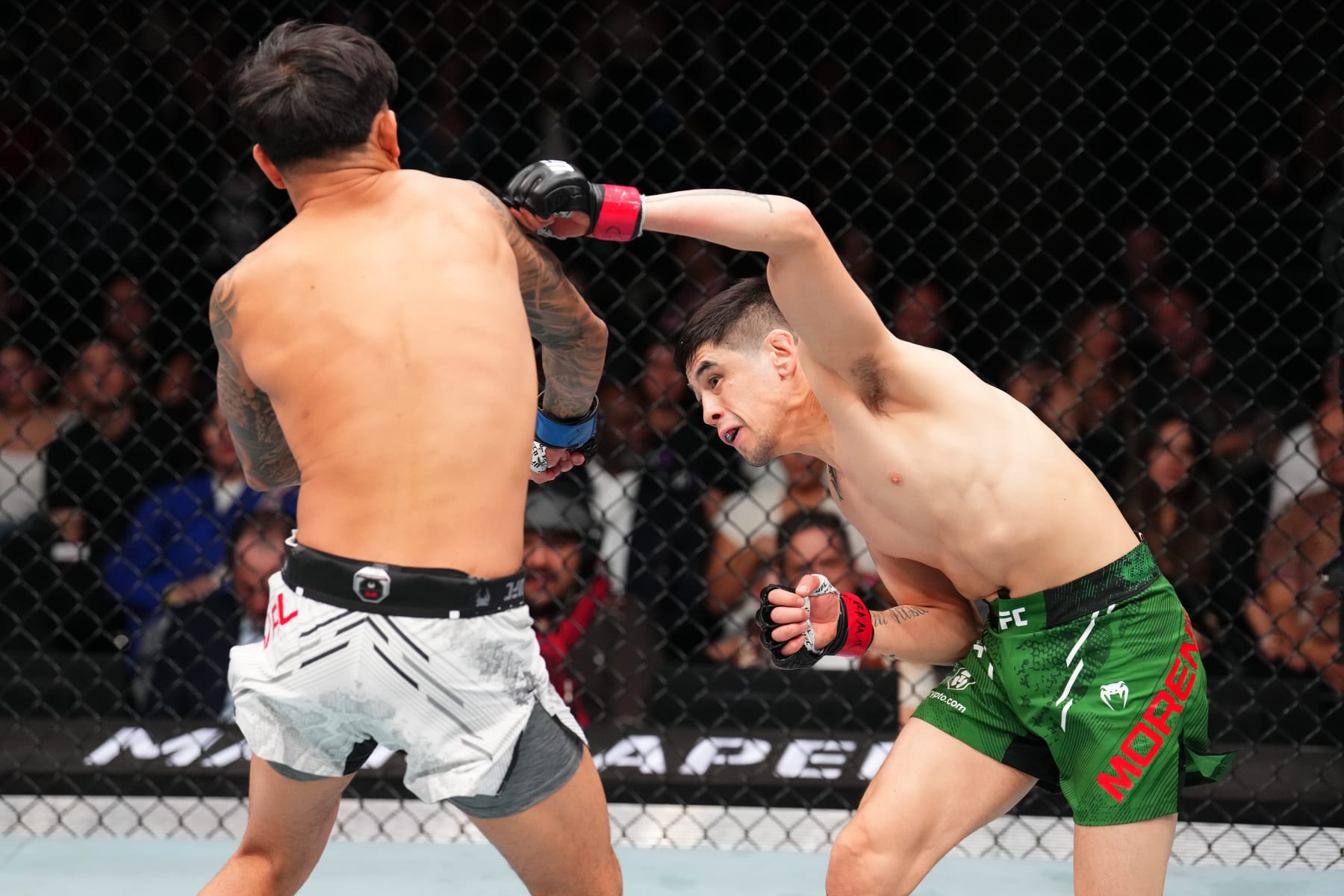 Brandon Moreno punches Brandon Royval