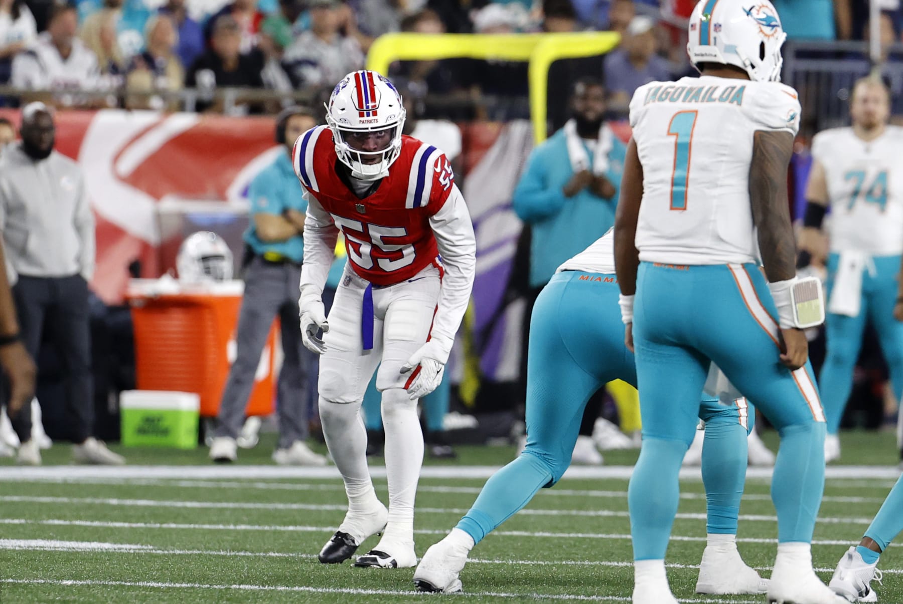 FOXBOROUGH, MA - SEPTEMBER 17: New England Patriots linebacker Josh Uche (55) eyes Miami Dolphins quarterback Tua Tagovailoa (1) during a game between the New England Patriots and the Miami Dolphins on September 17, 2023, at Gillette Stadium in Foxborough, Massachusetts. (Photo by Fred Kfoury III/Icon Sportswire via Getty Images)
