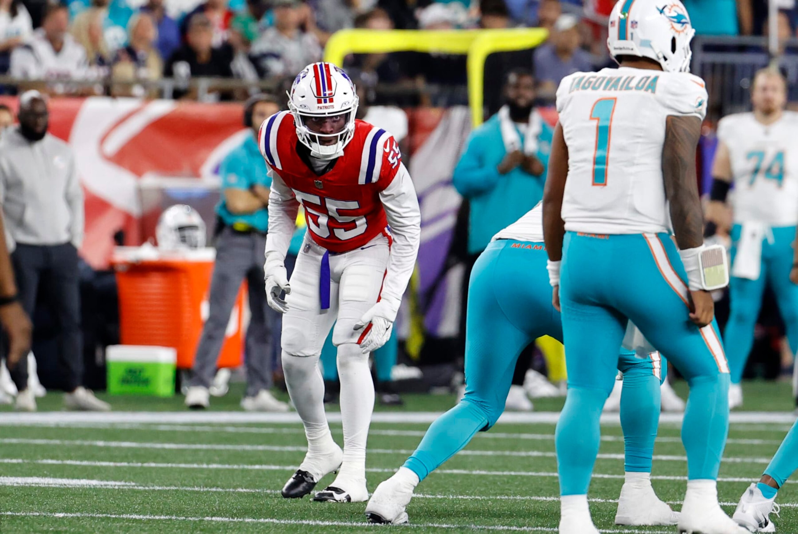 FOXBOROUGH, MA - SEPTEMBER 17: New England Patriots linebacker Josh Uche (55) eyes Miami Dolphins quarterback Tua Tagovailoa (1) during a game between the New England Patriots and the Miami Dolphins on September 17, 2023, at Gillette Stadium in Foxborough, Massachusetts. (Photo by Fred Kfoury III/Icon Sportswire via Getty Images)