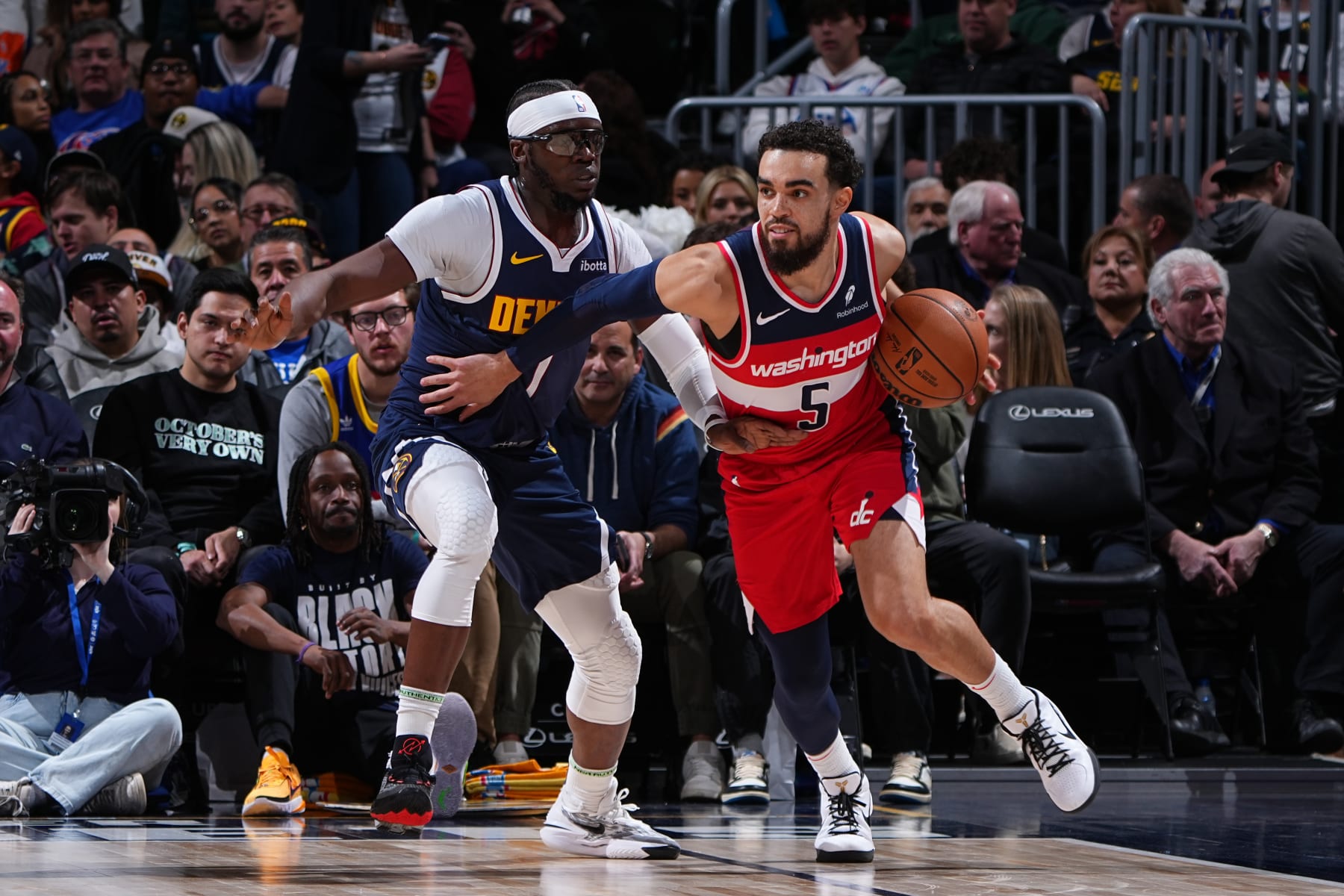 DENVER, CO - FEBRUARY 22: Tyus Jones #5 of the Washington Wizards dribbles the ball during the game against the Denver Nuggets on February 22, 2024 at the Ball Arena in Denver, Colorado. NOTE TO USER: User expressly acknowledges and agrees that, by downloading and/or using this Photograph, user is consenting to the terms and conditions of the Getty Images License Agreement. Mandatory Copyright Notice: Copyright 2024 NBAE (Photo by Garrett Ellwood/NBAE via Getty Images)