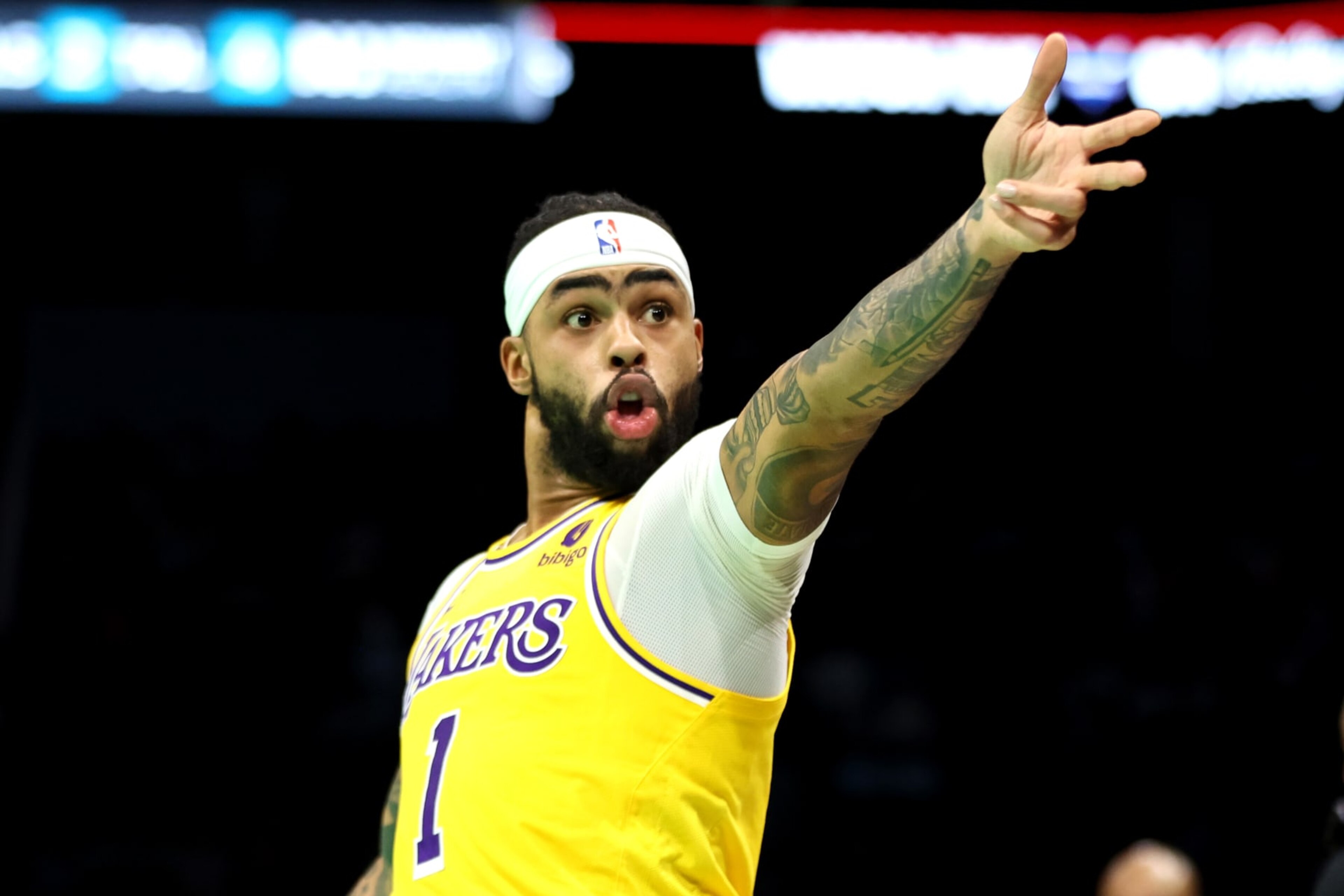 CHARLOTTE, NORTH CAROLINA - FEBRUARY 05: D'Angelo Russell #1 of the Los Angeles Lakers reacts after making a three pointer during the first half of a game against the Charlotte Hornets at Spectrum Center on February 05, 2024 in Charlotte, North Carolina. NOTE TO USER: User expressly acknowledges and agrees that, by downloading and or using this photograph, User is consenting to the terms and conditions of the Getty Images License Agreement. (Photo by David Jensen/Getty Images)
