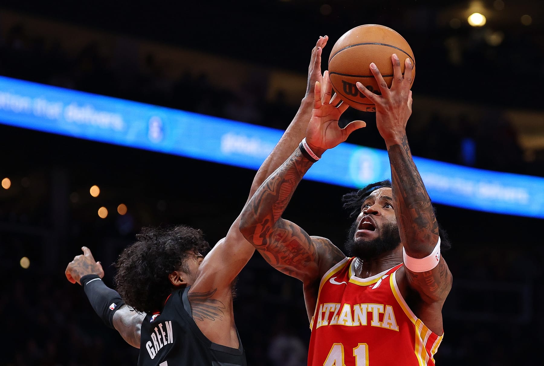ATLANTA, GEORGIA - FEBRUARY 10:  Saddiq Bey #41 of the Atlanta Hawks drives against Jalen Green #4 of the Houston Rockets during the second quarter at State Farm Arena on February 10, 2024 in Atlanta, Georgia.  NOTE TO USER: User expressly acknowledges and agrees that, by downloading and/or using this photograph, user is consenting to the terms and conditions of the Getty Images License Agreement.  (Photo by Kevin C. Cox/Getty Images)