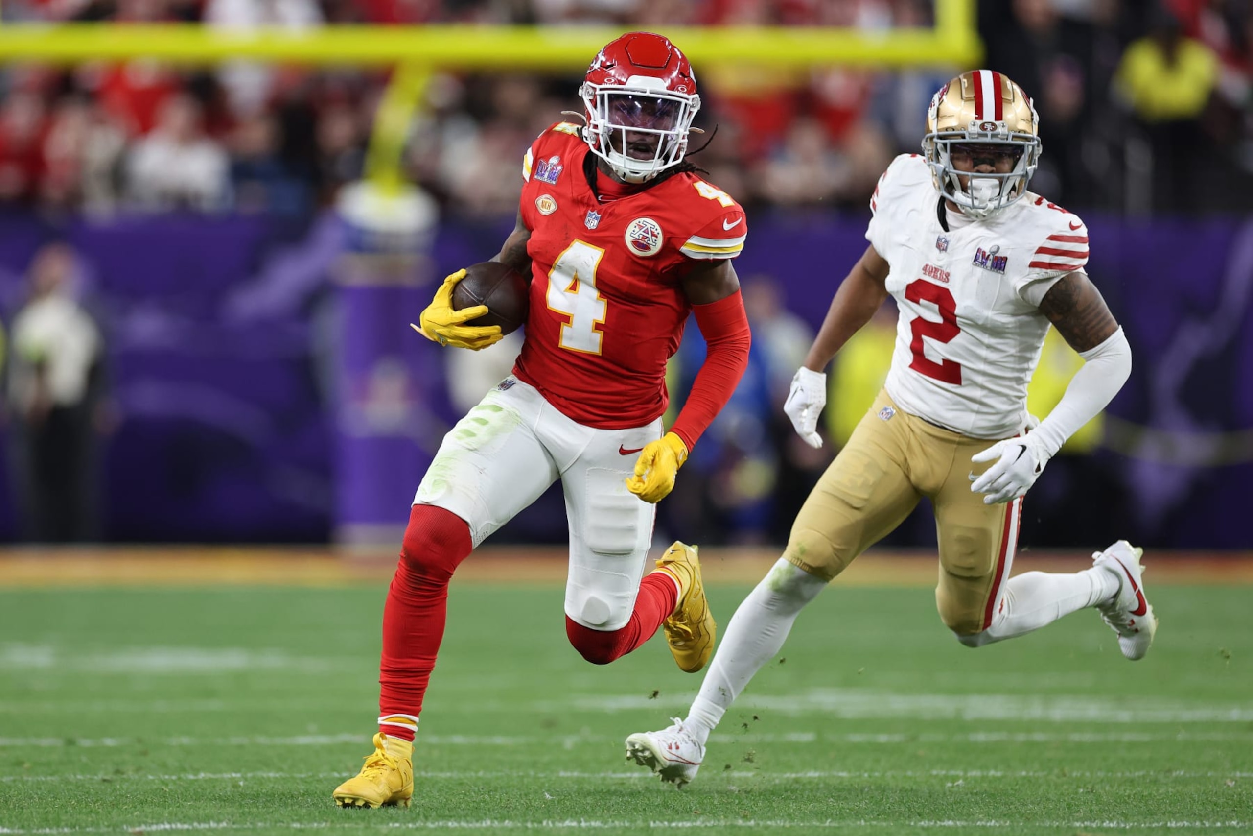 LAS VEGAS, NEVADA - FEBRUARY 11: Rashee Rice #4 of the Kansas City Chiefs runs the ball while being chased by Deommodore Lenoir #2 of the San Francisco 49ers in overtime during Super Bowl LVIII at Allegiant Stadium on February 11, 2024 in Las Vegas, Nevada. (Photo by Ezra Shaw/Getty Images) LAS VEGAS, NEVADA - FEBRUARY 11: Rashee Rice #4 of the Kansas City Chiefs runs the ball while being chased by Deommodore Lenoir #2 of the San Francisco 49ers in overtime during Super Bowl LVIII at Allegiant Stadium on February 11, 2024 in Las Vegas, Nevada. (Photo by Ezra Shaw/Getty Images)