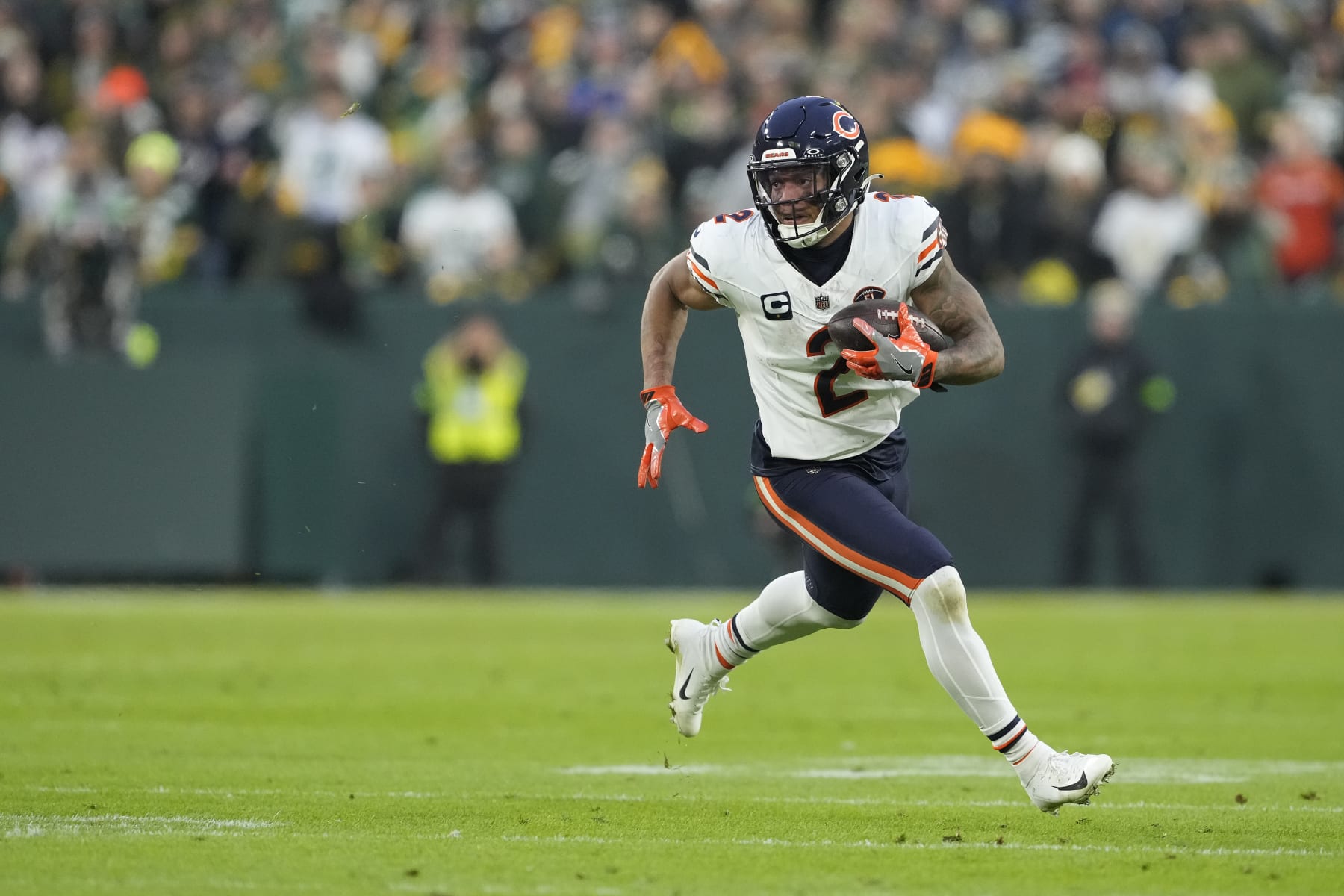 GREEN BAY, WISCONSIN - JANUARY 07: DJ Moore #2 of the Chicago Bears runs with the ball in the first half against the Green Bay Packers at Lambeau Field on January 07, 2024 in Green Bay, Wisconsin. (Photo by Patrick McDermott/Getty Images)