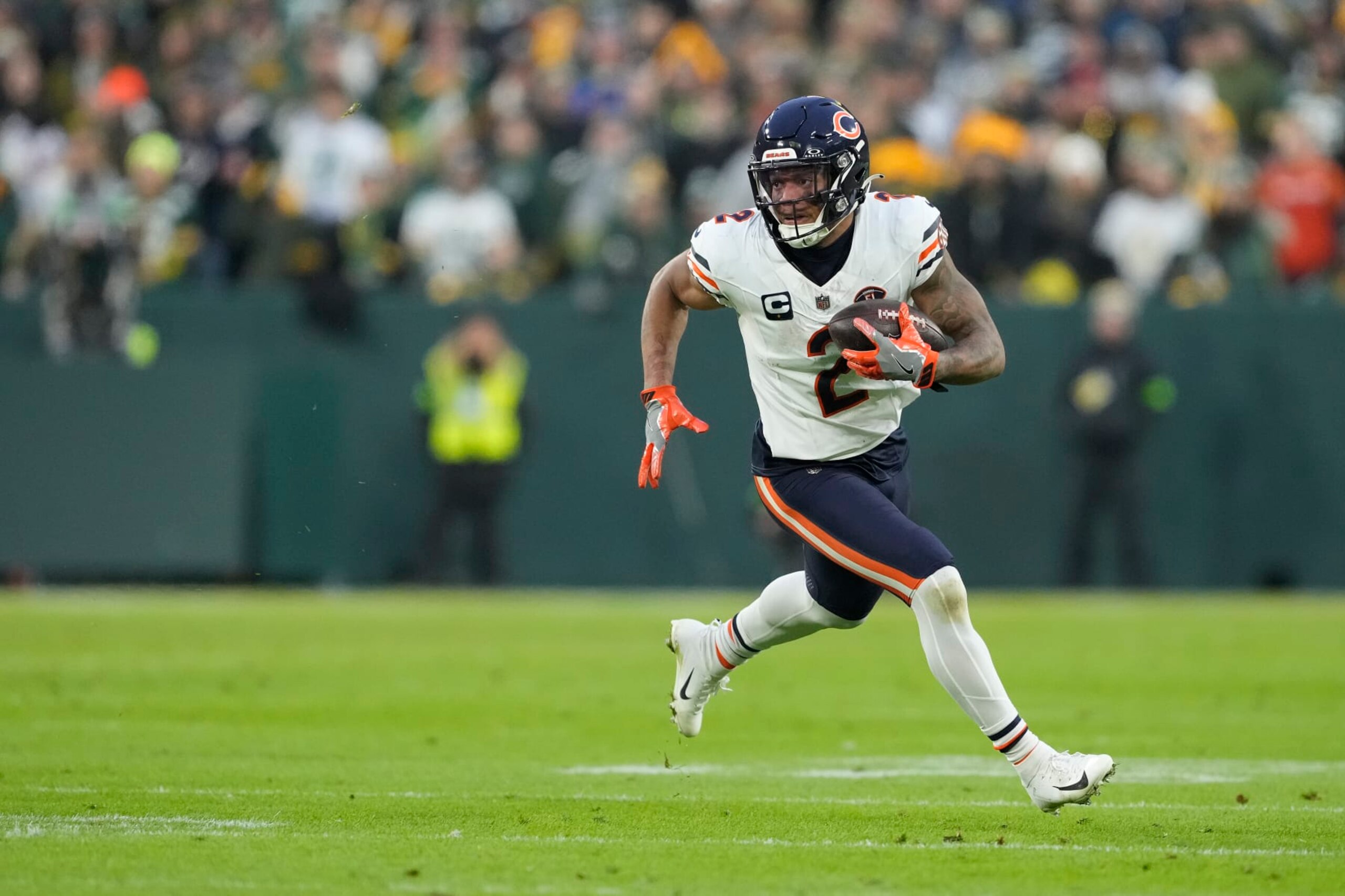 GREEN BAY, WISCONSIN - JANUARY 07: DJ Moore #2 of the Chicago Bears runs with the ball in the first half against the Green Bay Packers at Lambeau Field on January 07, 2024 in Green Bay, Wisconsin. (Photo by Patrick McDermott/Getty Images)