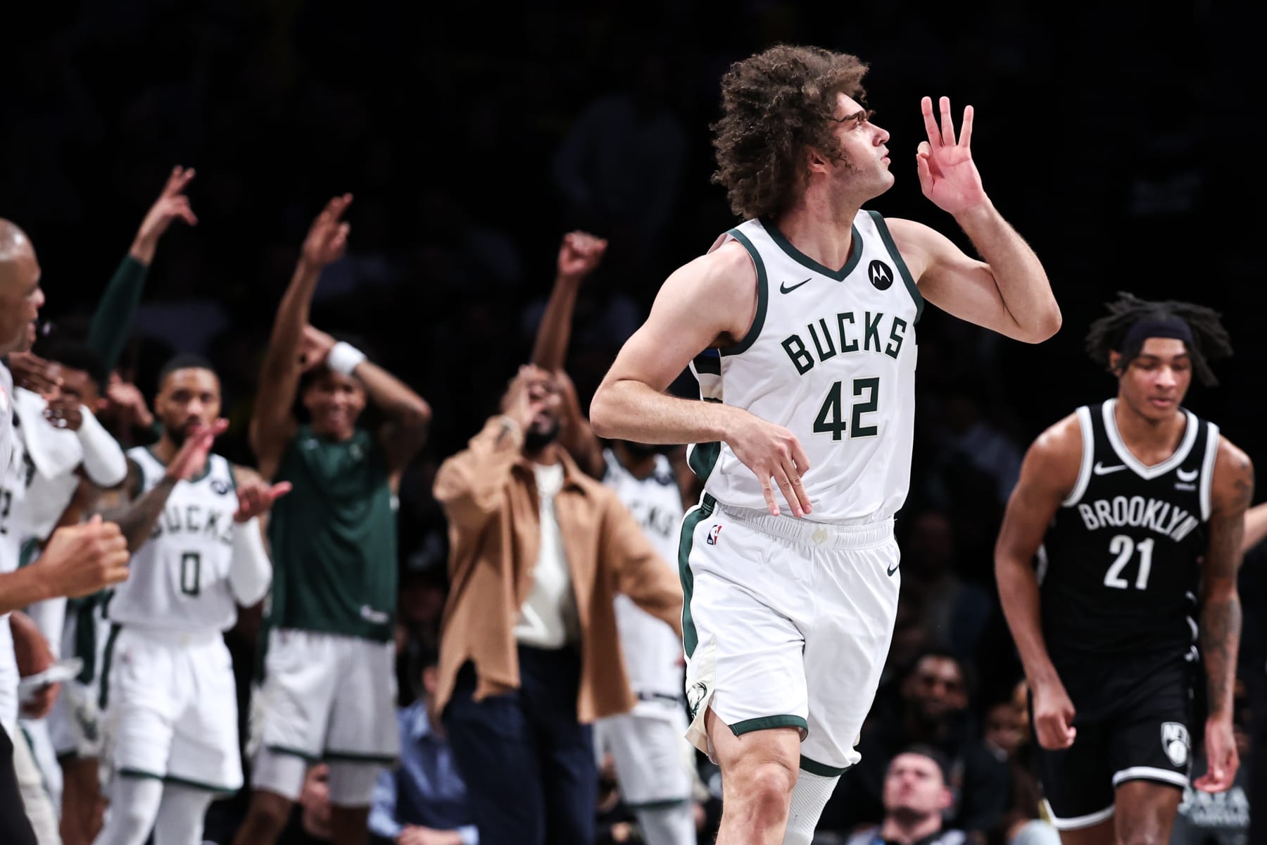 NEW YORK, NEW YORK - DECEMBER 27: Robin Lopez #42 of the Milwaukee Bucks reacts after making a three pointer during the fourth quarter against the Brooklyn Nets at Barclays Center on December 27, 2023 in New York City. NOTE TO USER: User expressly acknowledges and agrees that, by downloading and or using this photograph, User is consenting to the terms and conditions of the Getty Images License Agreement. (Photo by Dustin Satloff/Getty Images)