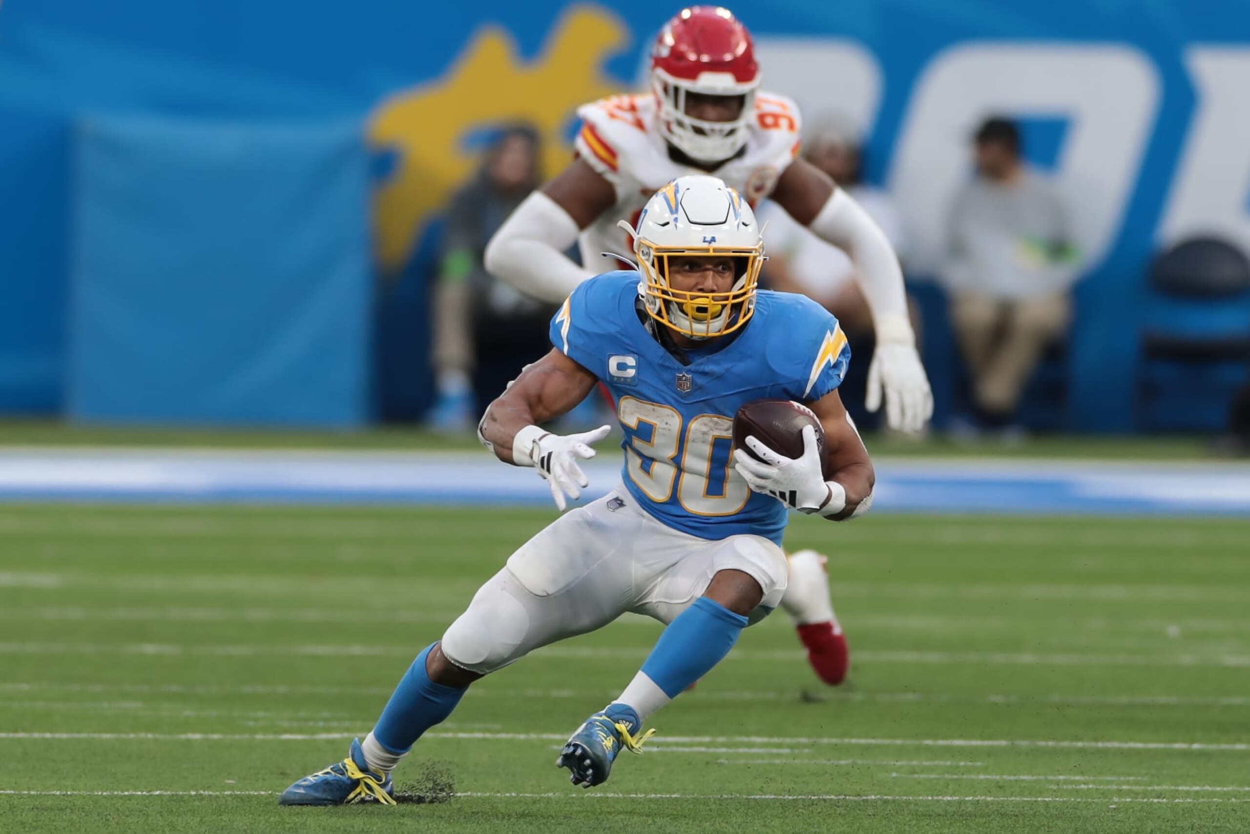 INGLEWOOD, CA - JANUARY 07: Los Angeles Chargers running back Austin Ekeler (30) cuts up field during the NFL game between the Kansas City Chiefs and the Los Angeles Chargers on January 07, 2024,  at SoFi Stadium in Inglewood, CA. (Photo by Jevone Moore/Icon Sportswire via Getty Images)