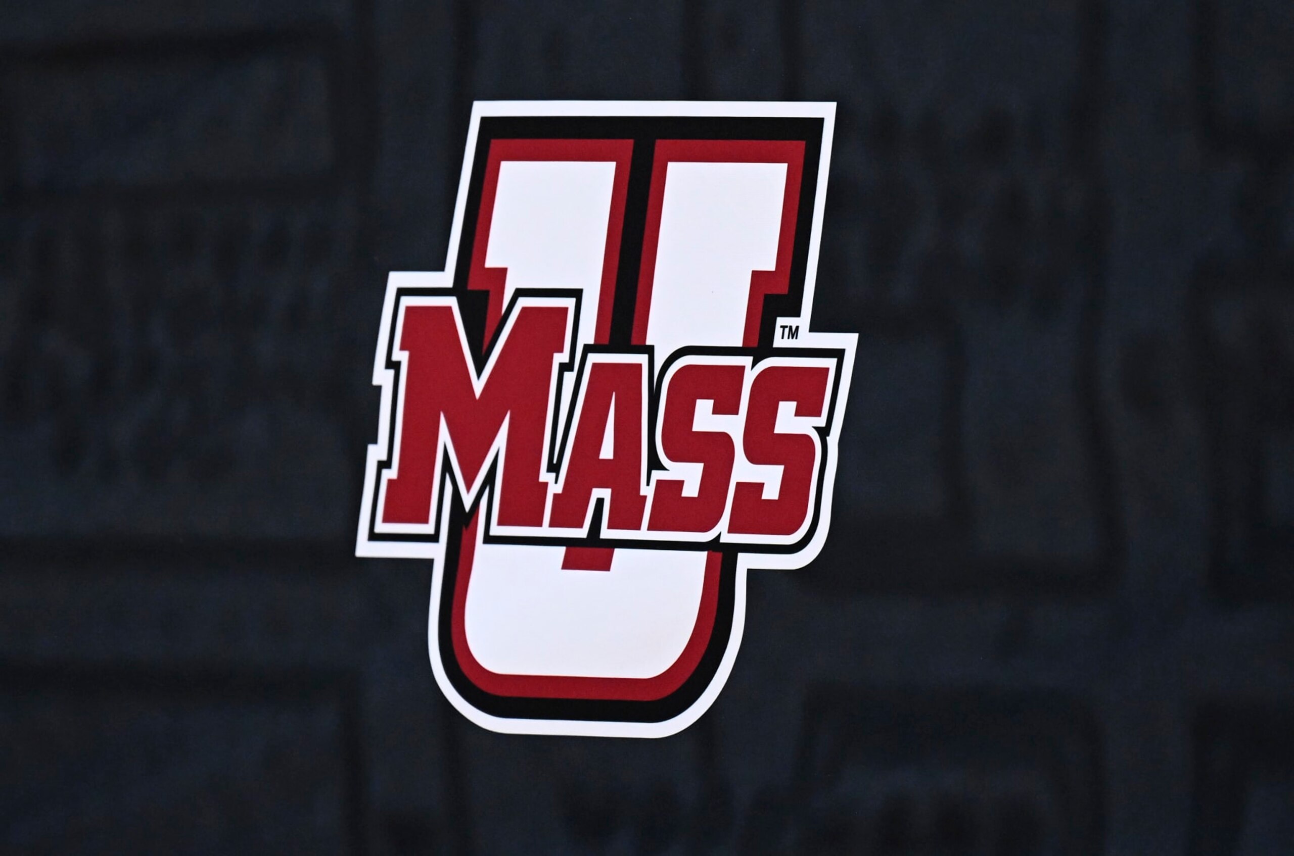 WASHINGTON, DC - MARCH 11: The Massachusetts Minutemen logo on display during the Quarterfinals of the 2022 Atlantic 10 Men's Basketball Tournament at Capital One Arena on March 11, 2022 in Washington, DC. (Photo by G Fiume/Getty Images)