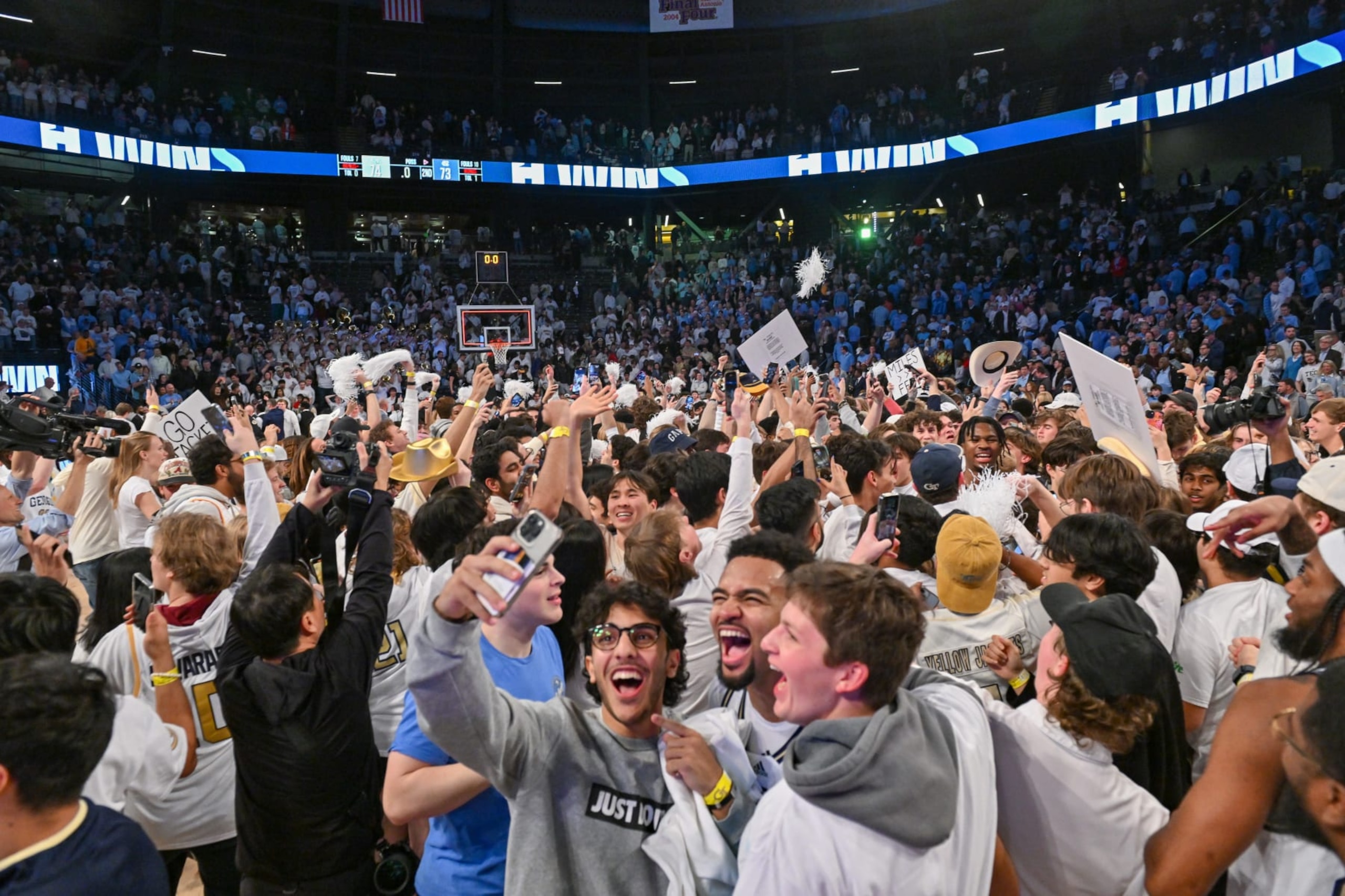 Georgia Tech fans storm the court after a January victory over North Carolina Georgia Tech fans storm the court after a January victory over North Carolina