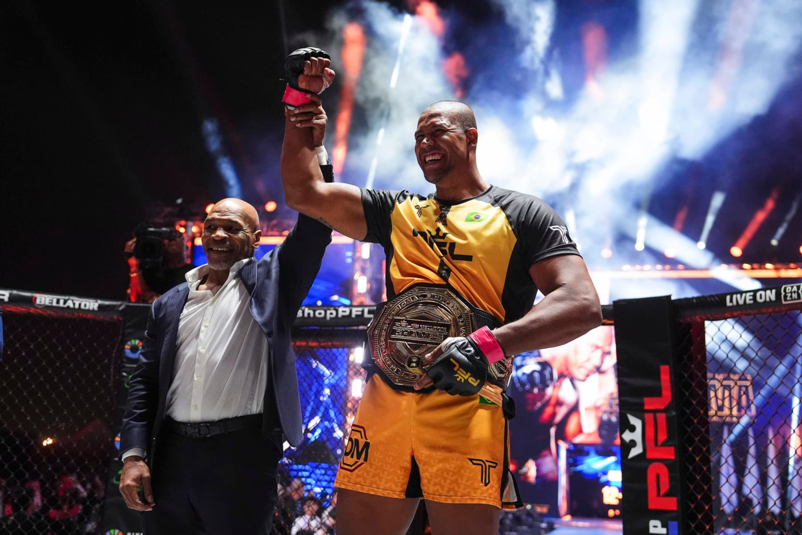 Renan Ferreira celebrates with Mike Tyson after defeating Ryan Bader 