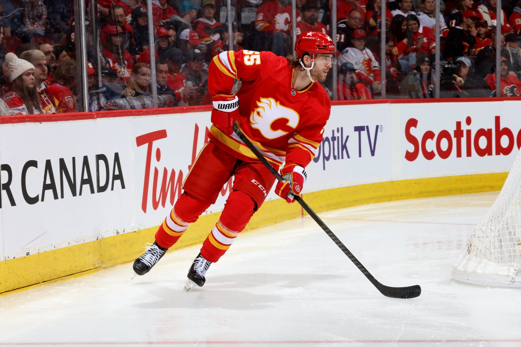 CALGARY, AB - FEBRUARY 15: Noah Hanifin #55 of the Calgary Flames skates against the San Jose Sharks at Scotiabank Saddledome on February 15, 2024 in Calgary, Alberta, Canada. (Photo by Gerry Thomas/NHLI via Getty Images)