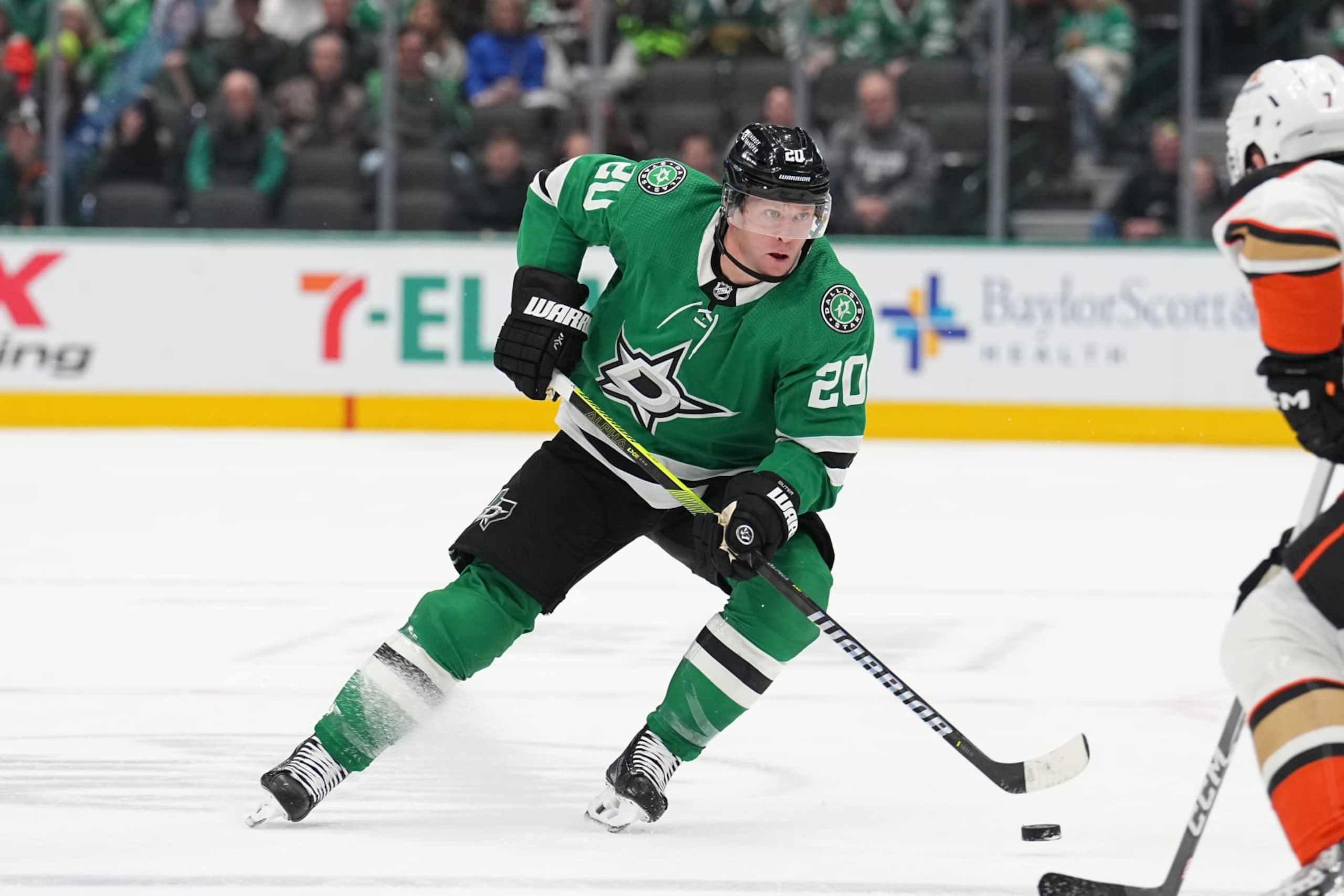 DALLAS, TX - JANUARY 25: Ryan Suter #20 of the Dallas Stars handles the puck against the Anaheim Ducks at the American Airlines Center on January 25, 2024 in Dallas, Texas. (Photo by Glenn James/NHLI via Getty Images)