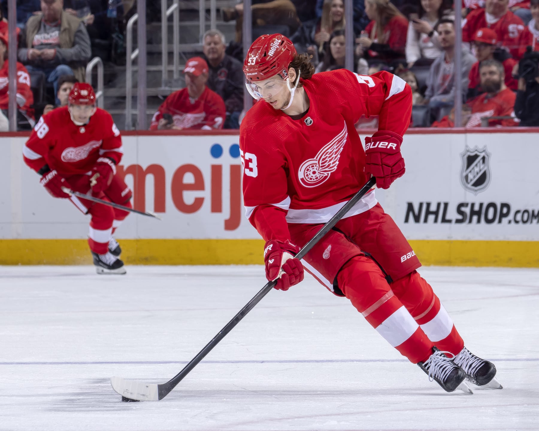 DETROIT, MI - FEBRUARY 10: Moritz Seider #53 of the Detroit Red Wings controls the puck against the Vancouver Canucks during the second period at Little Caesars Arena on February 10, 2024 in Detroit, Michigan. Detroit defeated Vancouver 4-3 in O.T. (Photo by Dave Reginek/NHLI via Getty Images)