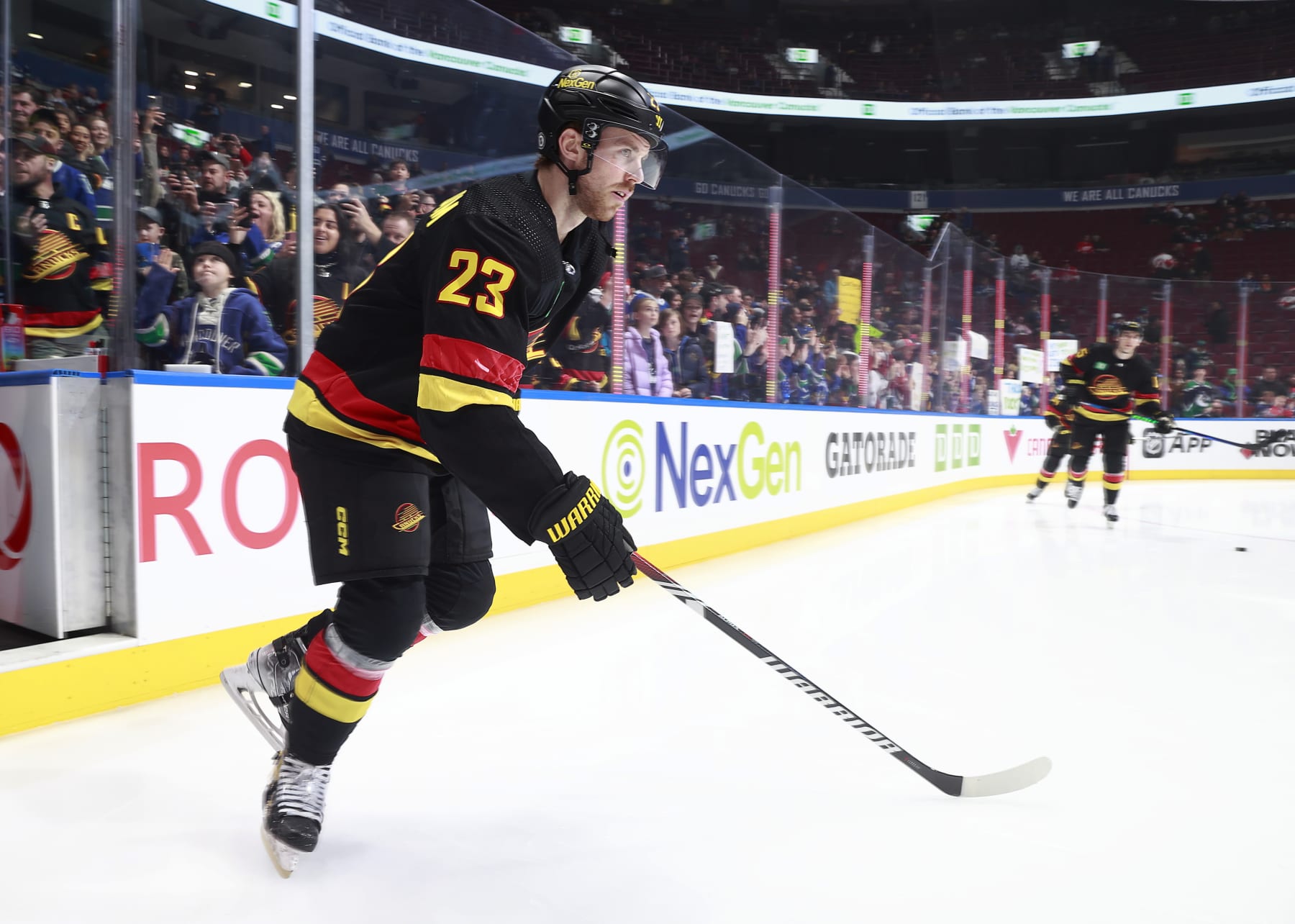 VANCOUVER, CANADA - FEBRUARY 15: Elias Lindholm #23 of the Vancouver Canucks steps onto the ice during their NHL game against the Detroit Red Wings at Rogers Arena on February 15, 2024 in Vancouver, British Columbia, Canada.  (Photo by Jeff Vinnick/NHLI via Getty Images)