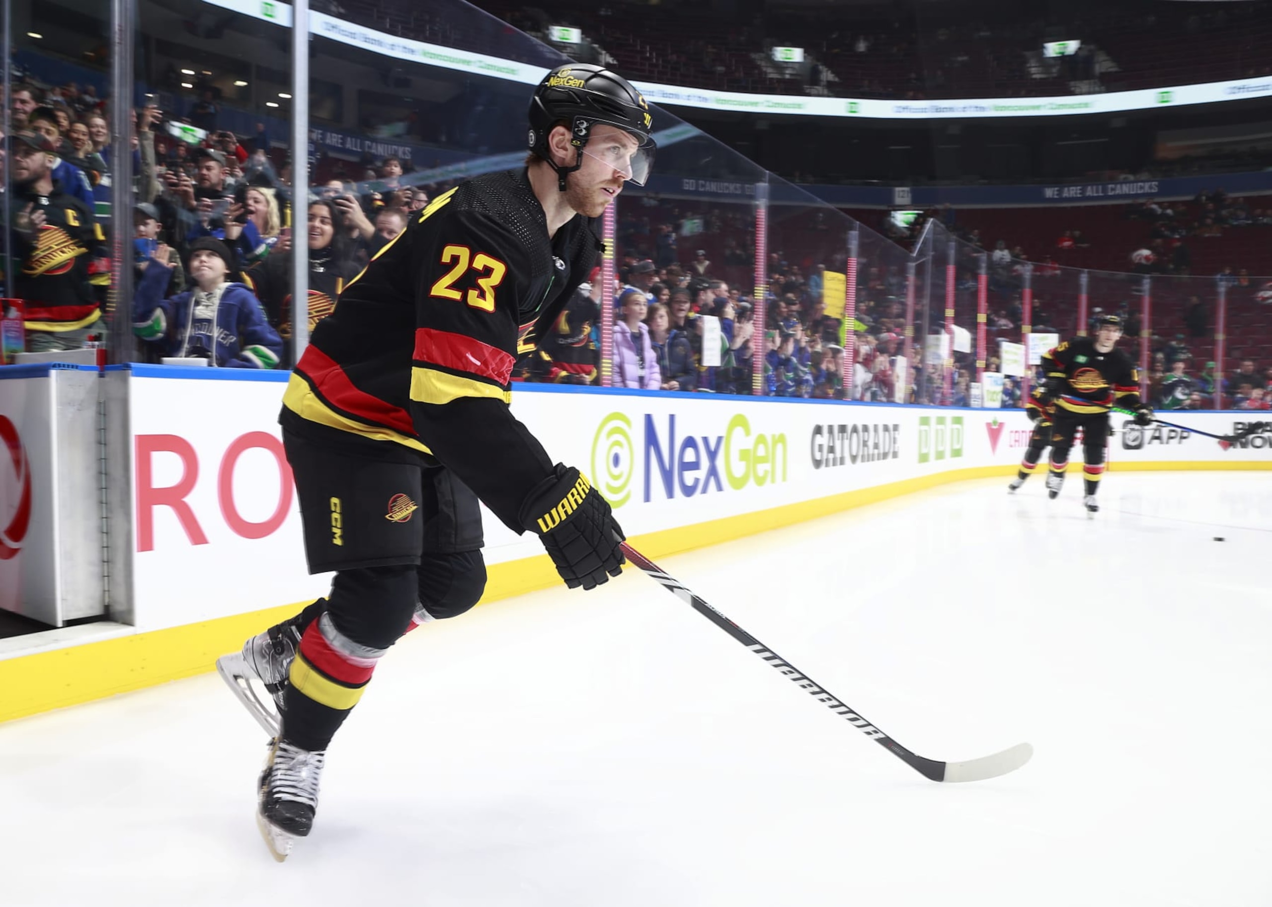 VANCOUVER, CANADA - FEBRUARY 15: Elias Lindholm #23 of the Vancouver Canucks steps onto the ice during their NHL game against the Detroit Red Wings at Rogers Arena on February 15, 2024 in Vancouver, British Columbia, Canada.  (Photo by Jeff Vinnick/NHLI via Getty Images)