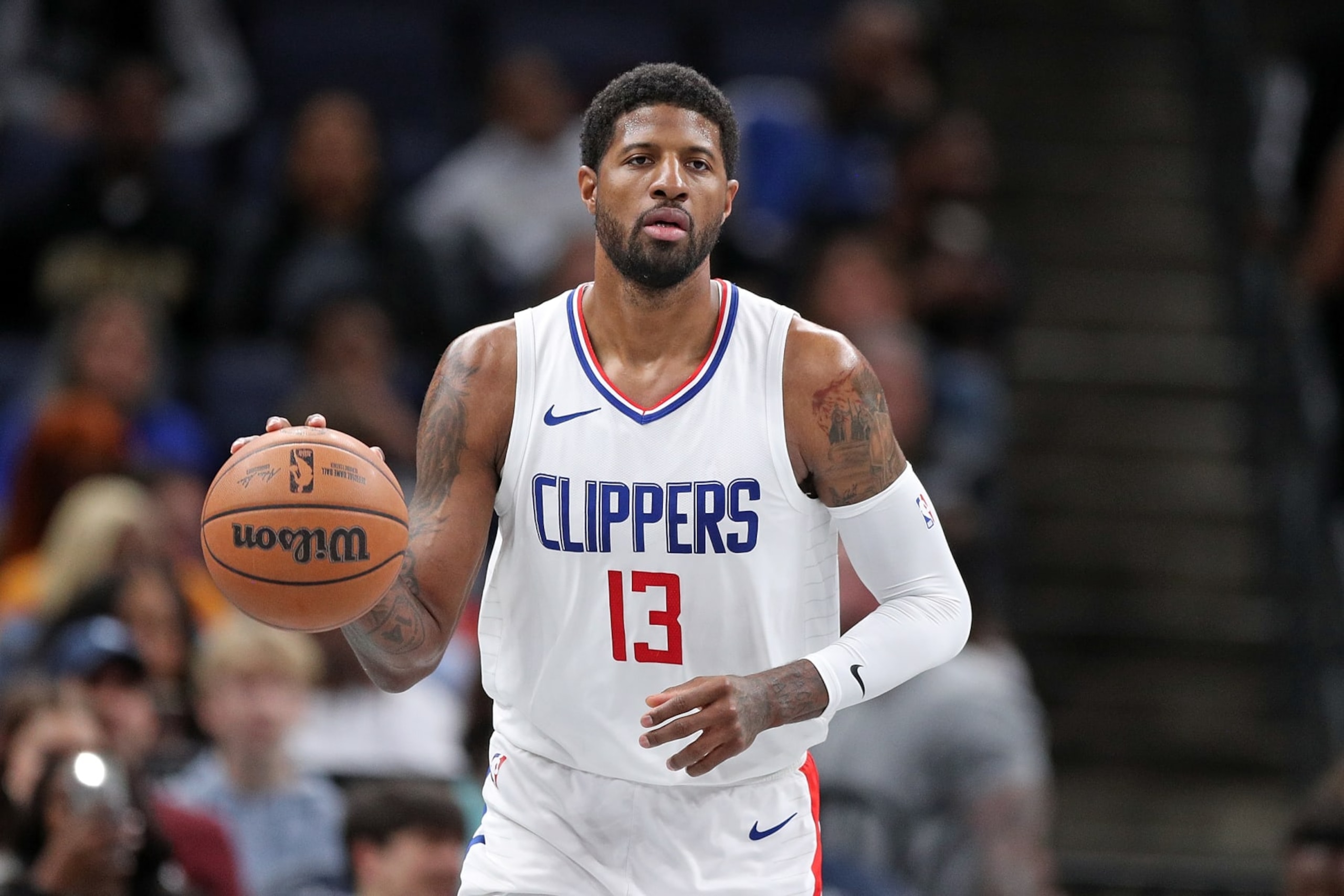 MEMPHIS, TENNESSEE - FEBRUARY 23: Paul George #13 of the Los Angeles Clippers handles the ball during the game against the Memphis Grizzlies at FedExForum on February 23, 2024 in Memphis, Tennessee. NOTE TO USER: User expressly acknowledges and agrees that, by downloading and or using this photograph, User is consenting to the terms and conditions of the Getty Images License Agreement. (Photo by Justin Ford/Getty Images)