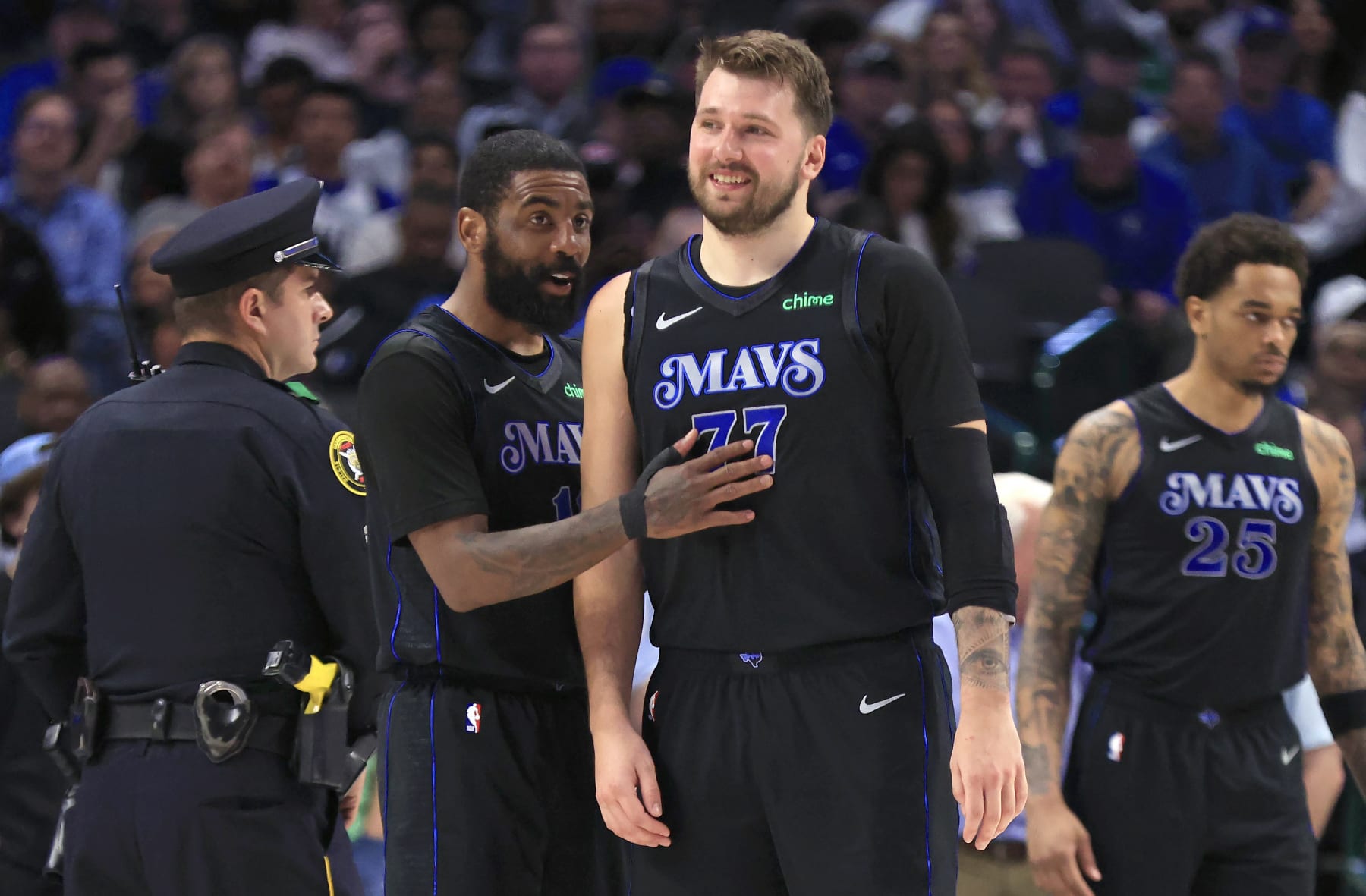 DALLAS, TX - FEBRUARY 22: Kyrie Irving #11 of the Dallas Mavericks and teammate Luka Doncic #77 react after a basket against the Phoenix Suns in the second half at American Airlines Center on February 22, 2024 in Dallas, Texas. NOTE TO USER: User expressly acknowledges and agrees that, by downloading and or using this photograph, User is consenting to the terms and conditions of the Getty Images License Agreement. (Photo by Ron Jenkins/Getty Images)