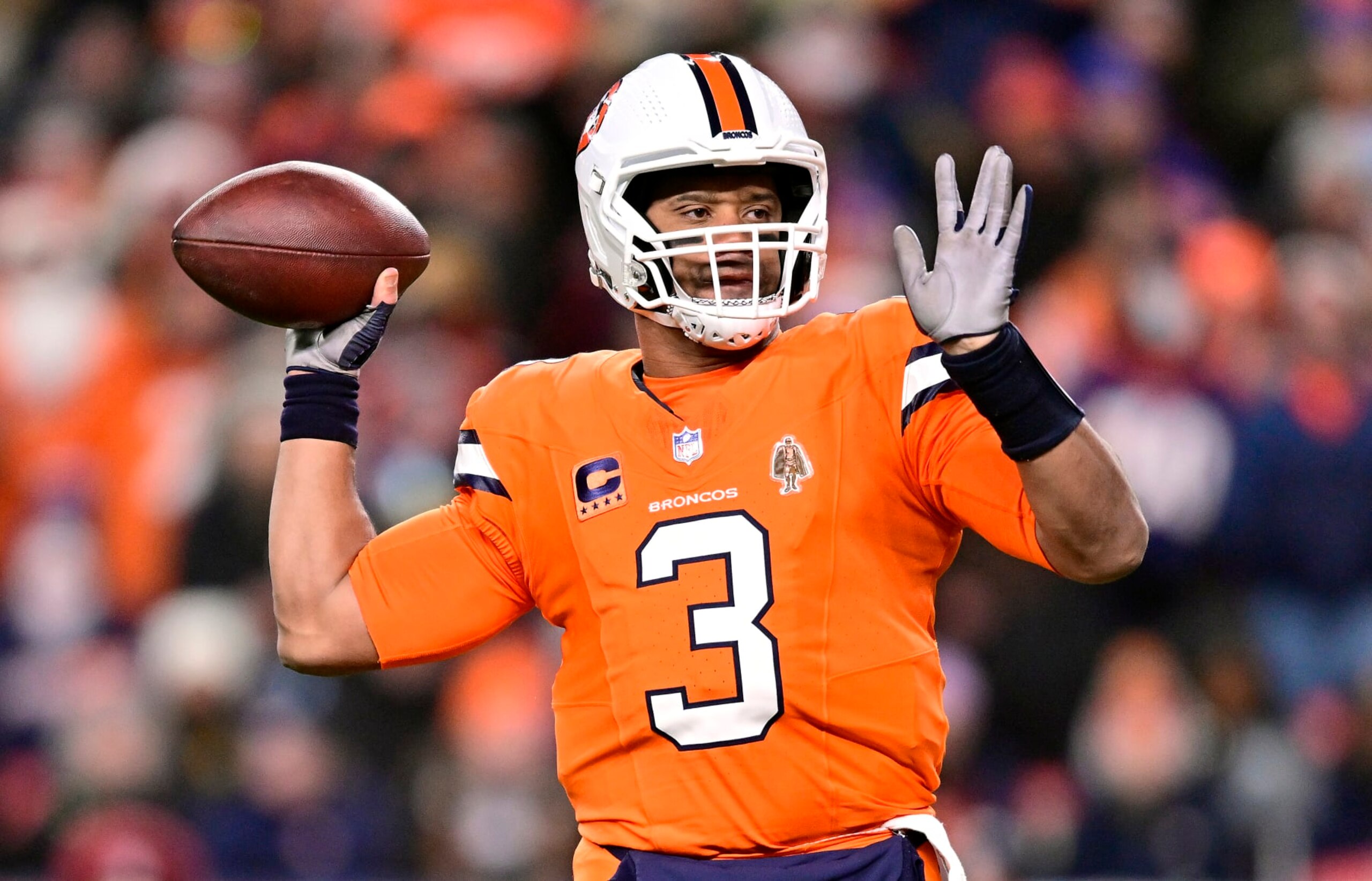 DENVER, COLORADO - DECEMBER 24:  Quarterback Russell Wilson #3 of the Denver Broncos passes during the 1st quarter of the game against the New England Patriots at Empower Field At Mile High on December 24, 2023 in Denver, Colorado. (Photo by Dustin Bradford/Getty Images)